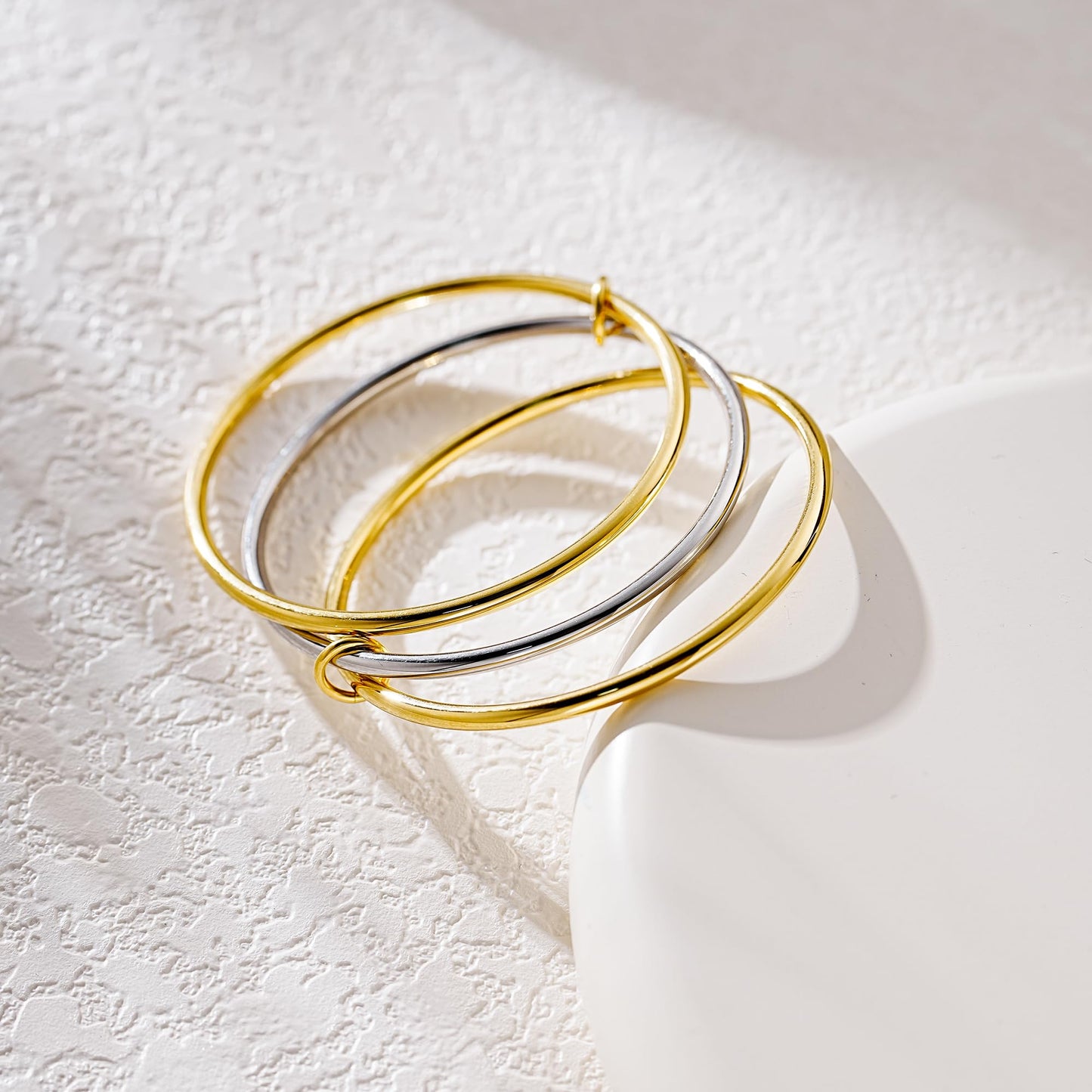 NOKMIT Triple Interlocked Stackable Bangle Bracelets for Women 3-Pack Two-Tone High Polished Stainless Steel Bangle Set Classic Plain Thin Non-Tarnish Gold&Silver (8.0 inch)