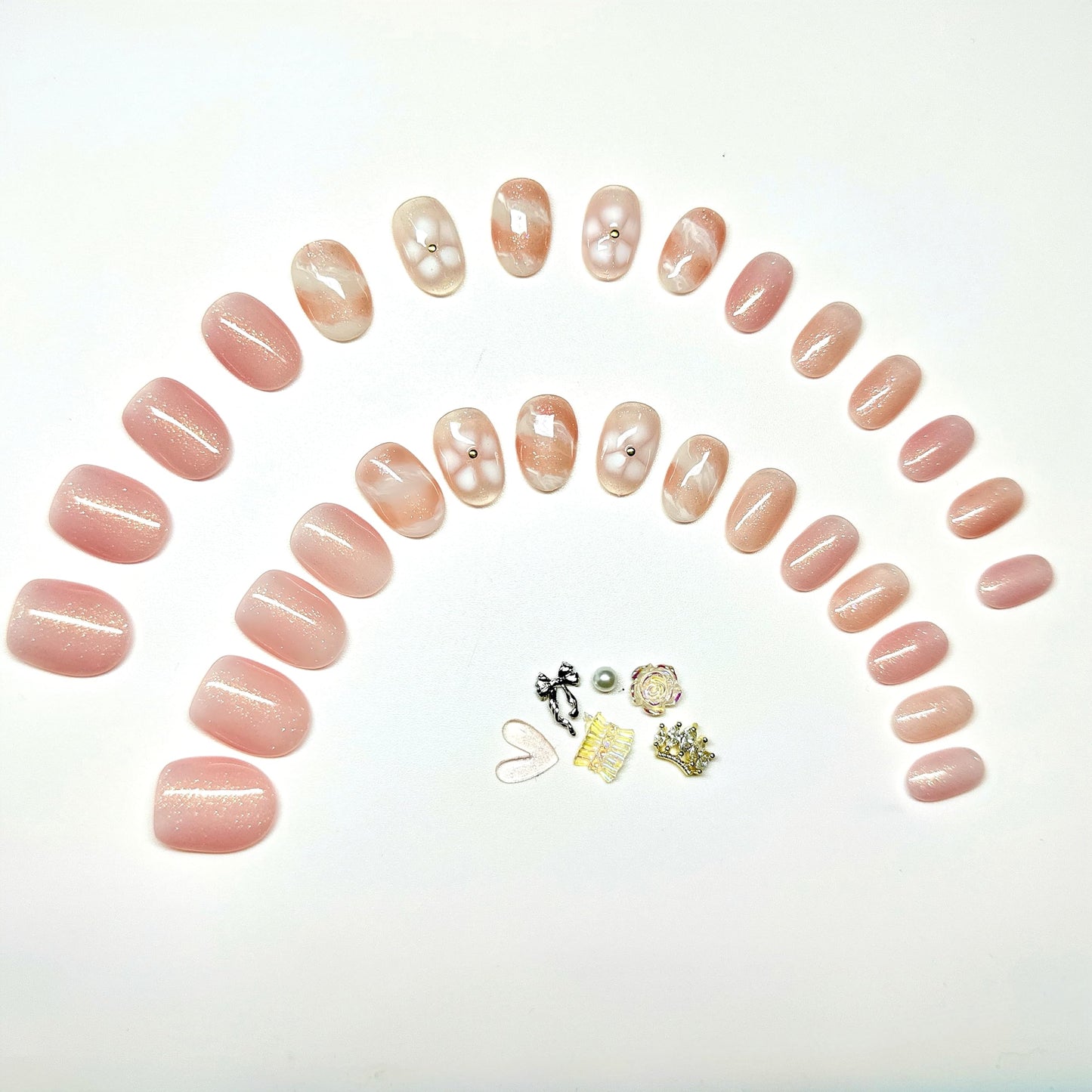 Sunruby Hand-Painted Press-On Nails – Short Oval in Rosé Pink with White Floral Accents. Reusable Soft Gel Set (15 Sizes, 30 Nails + Glue) | Designed in Los Angeles | Rosé Luminesse