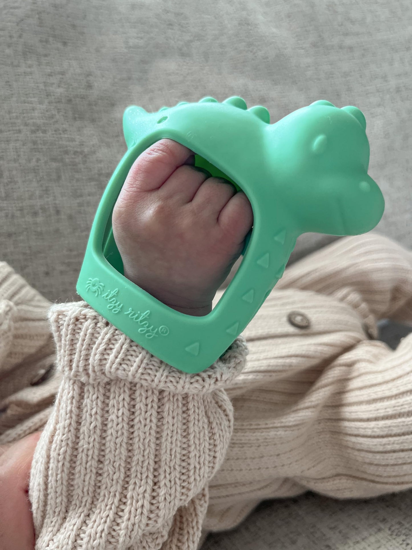 Itzy Ritzy Bitzy Grip Hand Teether - Silicone Teether for Babies - Developmental Teething Toy with Easy-to-Hold Hand Grip, Designed for Babies 3 Months & Up (Dinosaur)