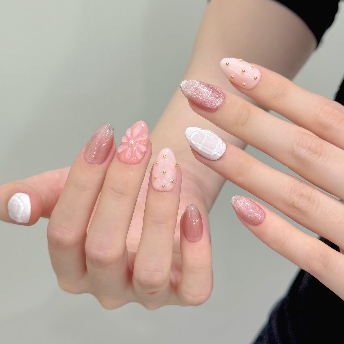 Tesytto Nude Pink Press on Nails Short Almond Cat Eye Fake Nails with 3D Sleek Water Drop Design Glossy Finish Glitter Full Cover Acrylic Nails (Ice Flowers,S)