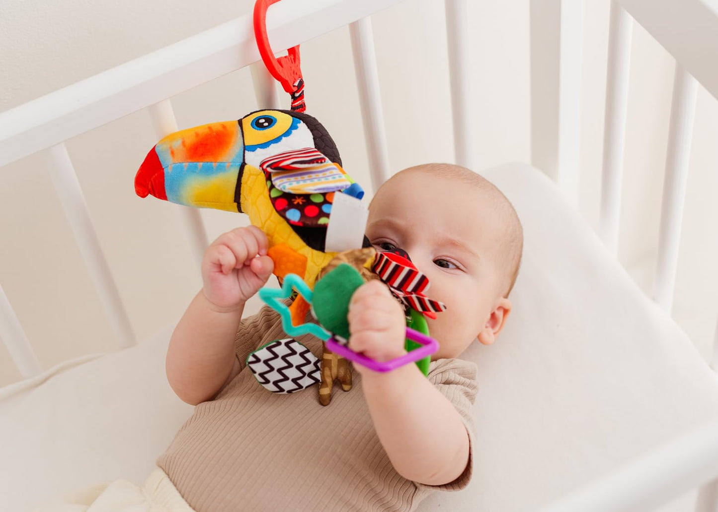 Balibazoo Toucan Hanging Baby Toy – Soft Plush Sensory Rattle with Crinkle Wings, Hidden Bell & BPA-Free Teether | Clip Attaches to Stroller, Car Seat, Gym | Developmental Toy for Babies 0-24M
