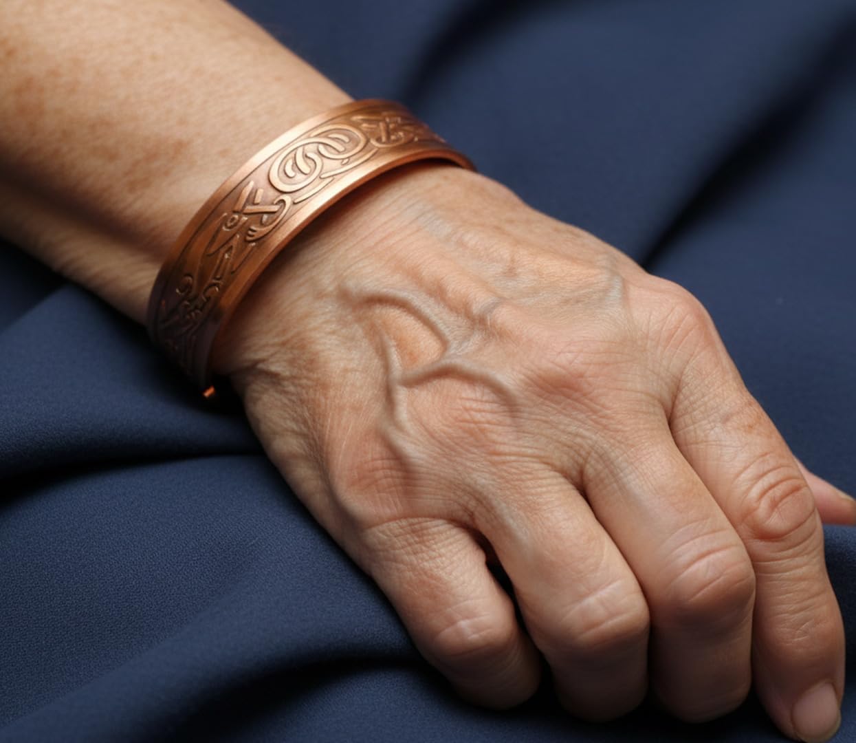 Touchstone handcrafted magnetic copper bracelet. Hand forged with solid and high gauge Tibetan style engraved cuff pure copper jewelry for women men. Attractive Celtic Design.