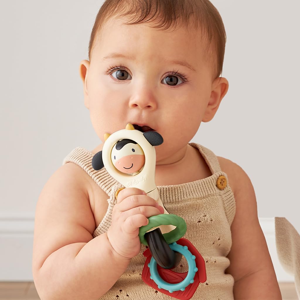 Itzy Ritzy Spinner Rattle Toy – Cow Design Sensory Teething Rattle Includes Spinning Face, Clicks, Rattles & Textured Teethers – Designed for Ages 3 Months and Up (Cow)