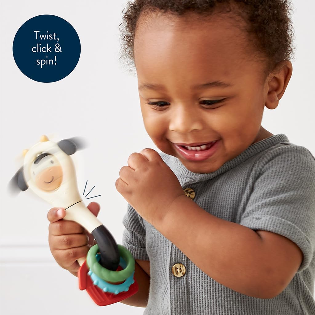 Itzy Ritzy Spinner Rattle Toy – Cow Design Sensory Teething Rattle Includes Spinning Face, Clicks, Rattles & Textured Teethers – Designed for Ages 3 Months and Up (Cow)