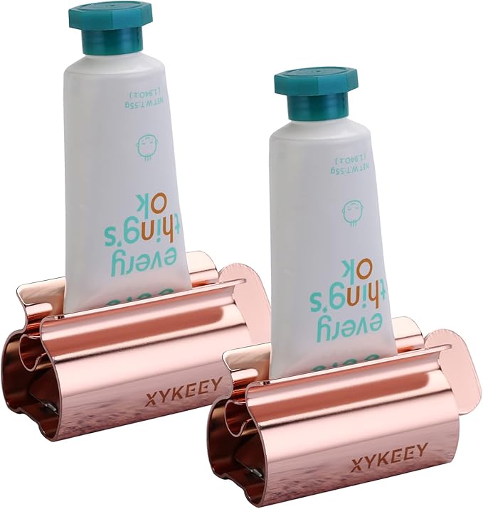 XYKEEY Toothpaste Tube Squeezer - Set of 2 Toothpaste Squeezer Rollers, Metal Toothpaste Tube Wringer Seat Holder Stand (Coral)