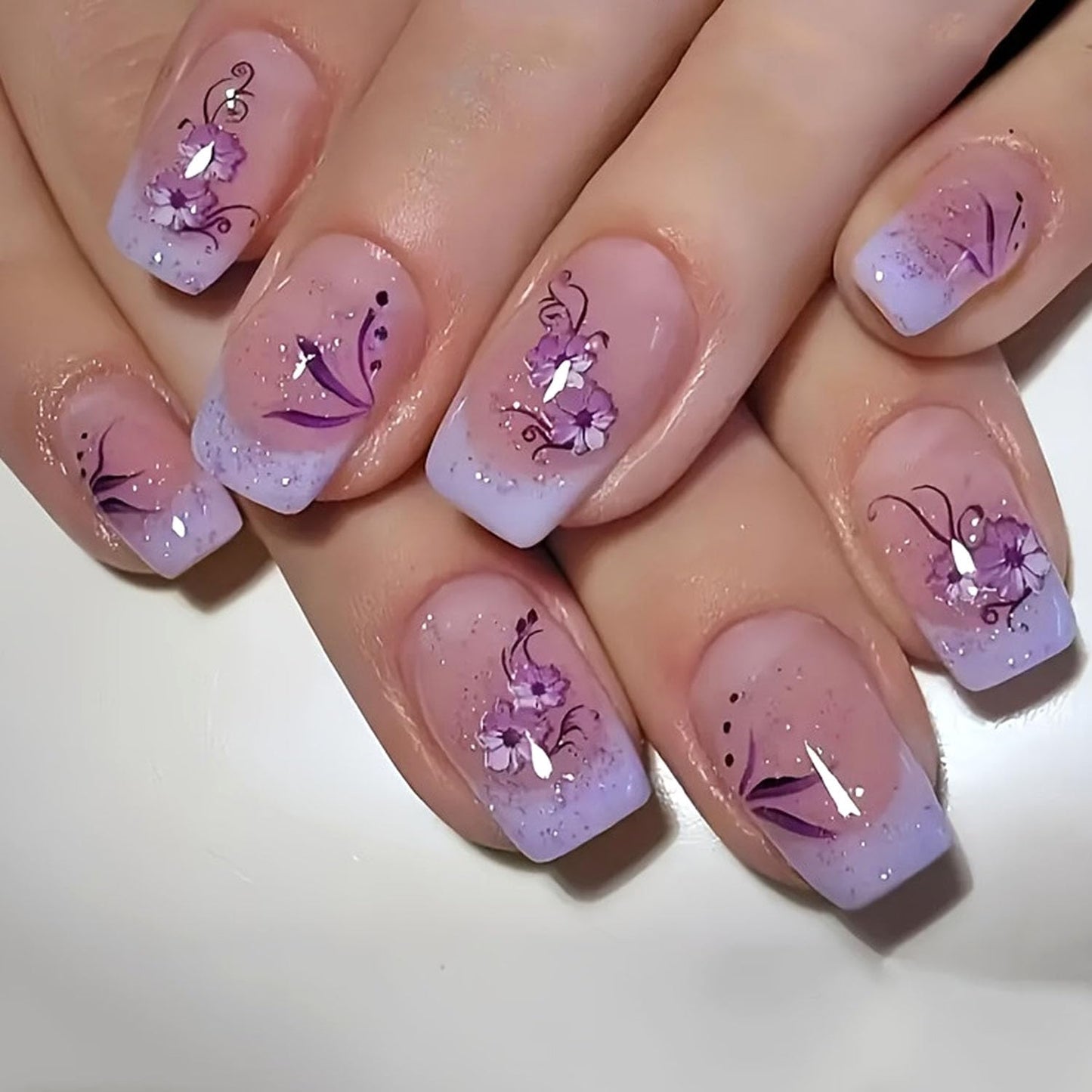 French Press on Nails Medium Short Fake Nails with Glitter Designs Purple Flowers Glue on Nails Translucent Nails Press ons Spring False Nails for Women 24 Pcs
