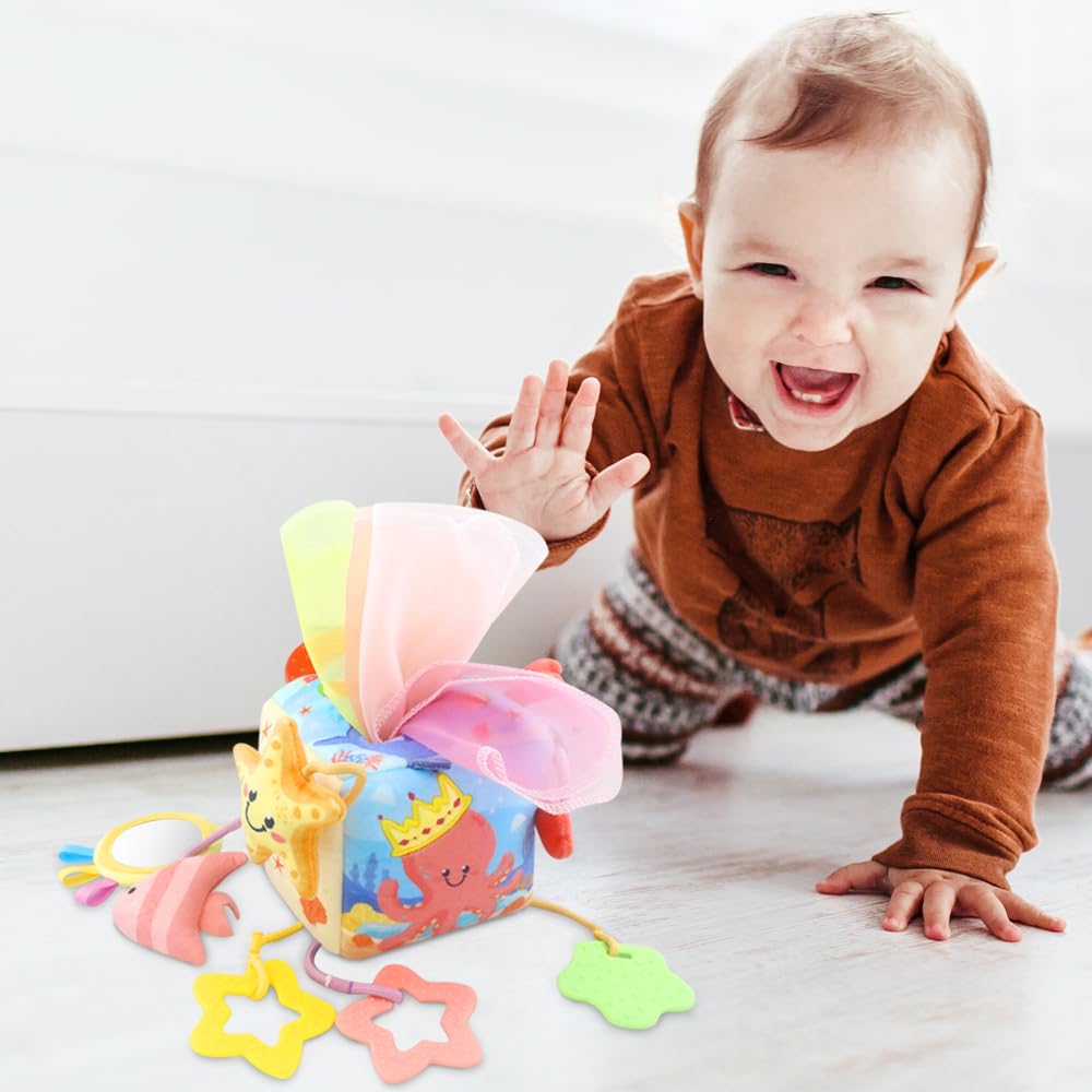 Caterbee Baby Sensory Tissue Box Toy with Hanging Hook – Pull Out Fabric Tissues, Rattle & Teether, Montessori Stroller & Car Seat Toy for Infants (Ocean)