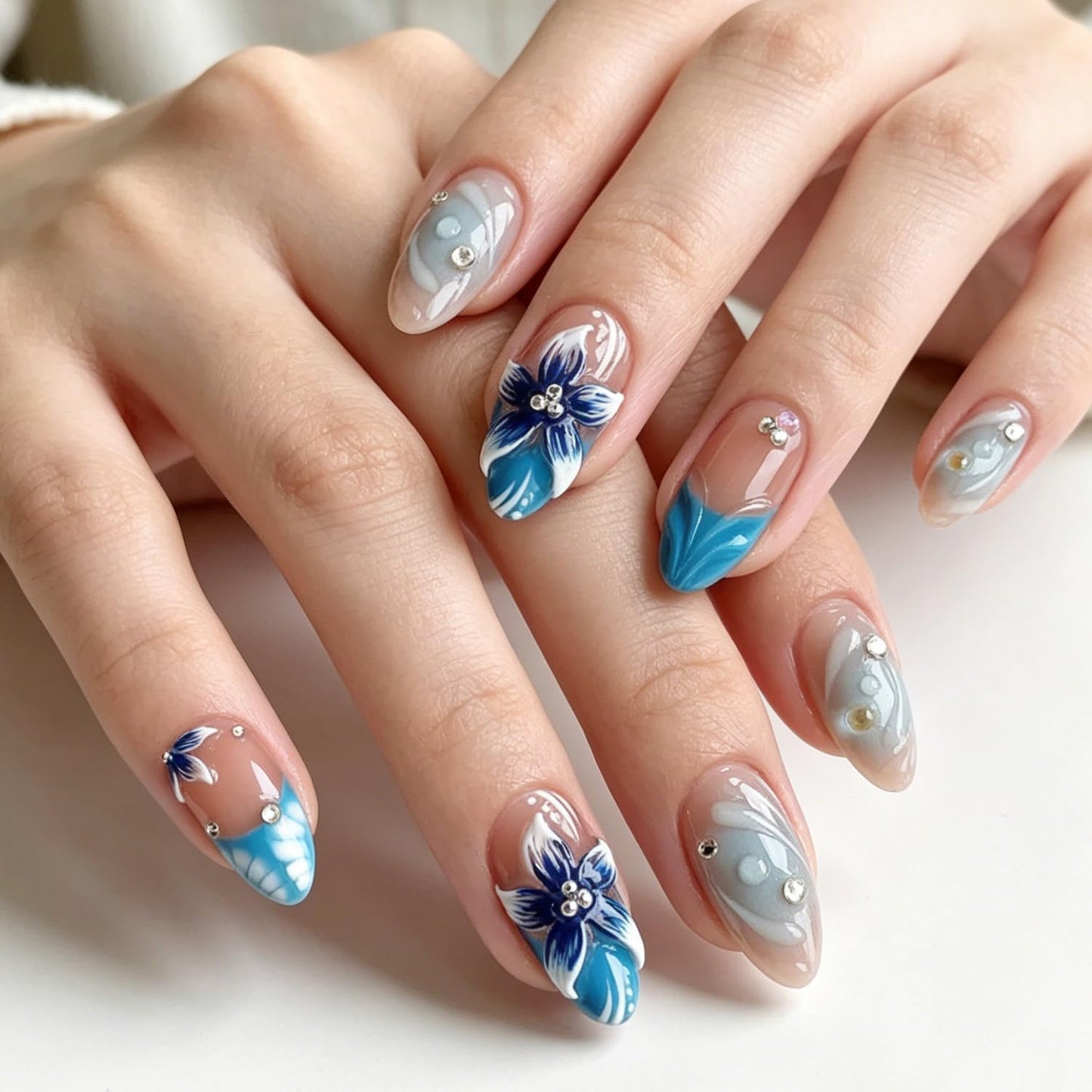Nude Blue Ocean Press on Nails, Medium Almond Handmade 3D Flower Fake Nails with Rhinestone Designs,Glossy Reusable False Nails with Glue Tabs for Summer Vacation 30Pcs Nail Kit for Women