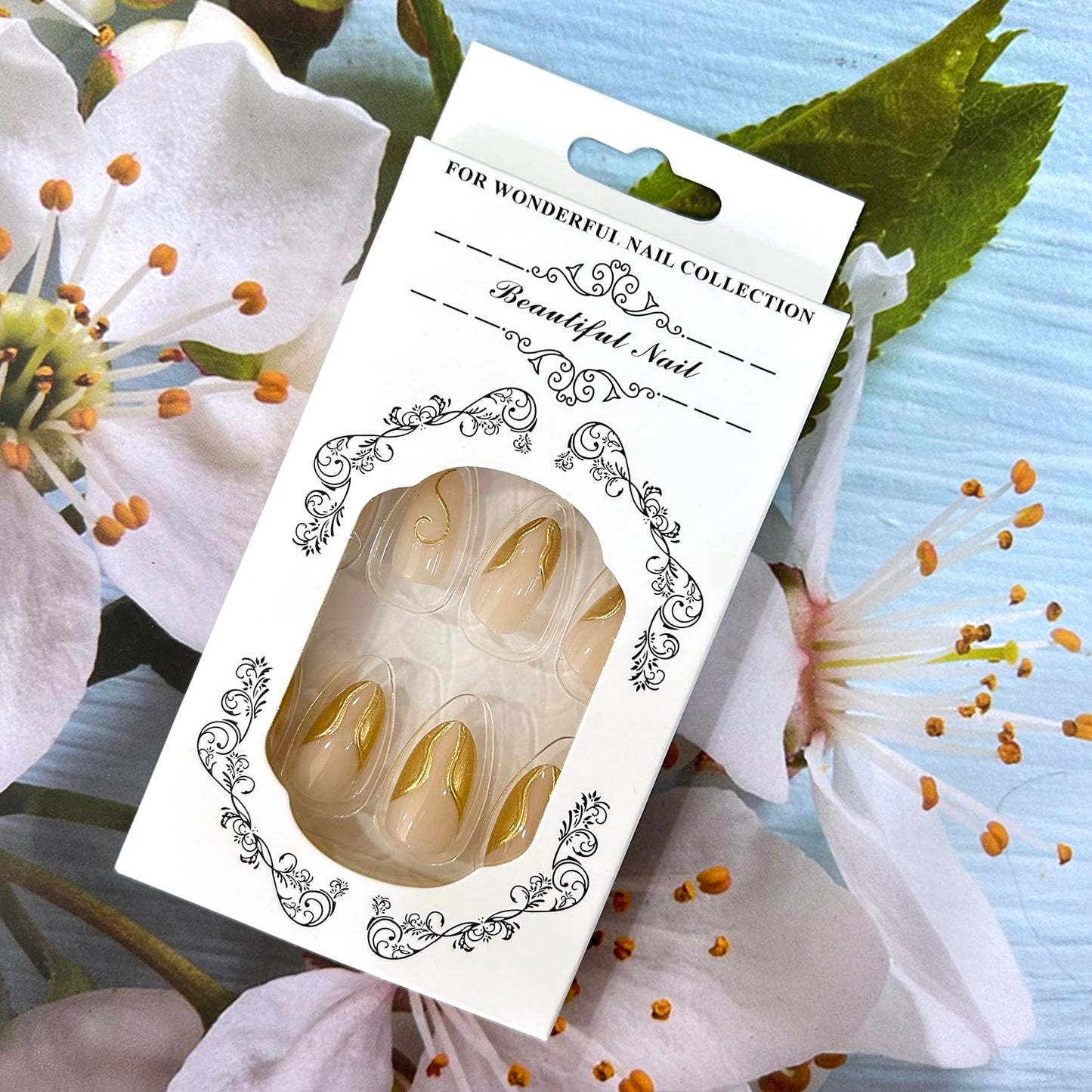 CJDLTS Gold Press on Nails Medium Length Golden 3D Irregular Lines Design False Nail Nude Artificial Stick on Nails Acrylic Press Ons Reusable Glue on Nail for Women 24Pcs