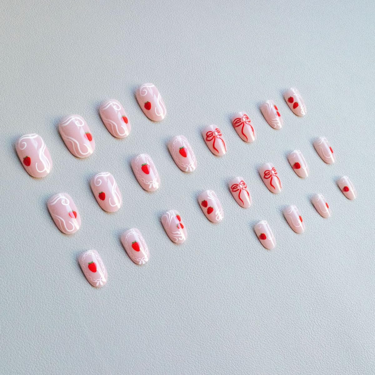 Medium Oval Press on Nails Nude Fake Nails Spring Nails Press ons with Cute Strawberry, Bow Design,Reusable Artificial Nail Full Cover Stick on Nails for Women Manicure 24Pcs
