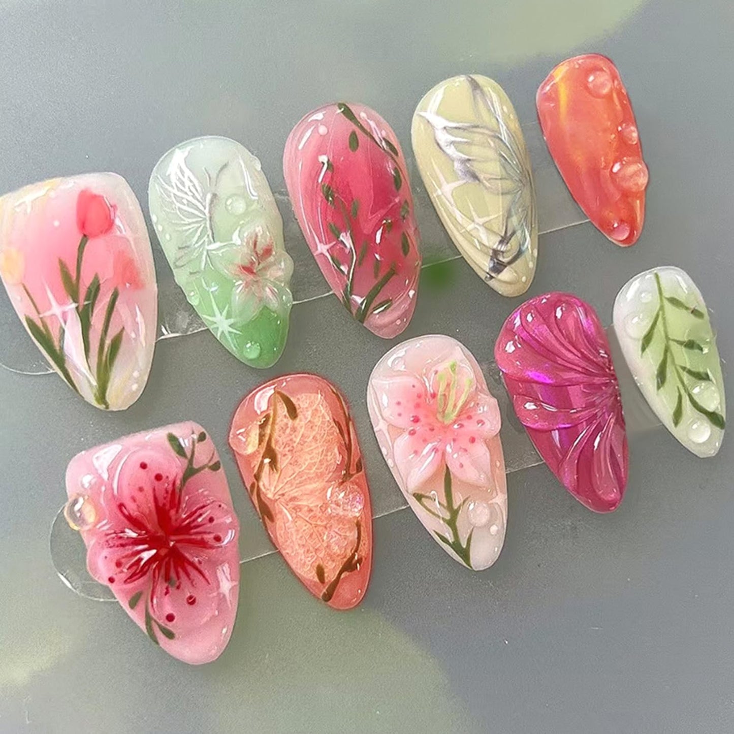 CJDLTS Colorful Flower Press on Nails Medium Almond Artificial Acrylic Nail 3D Blush Floral with Bubble Design Stick on Nails Full Cover Reusable Coffin Glue on Nail Artificial Fingernails for Women