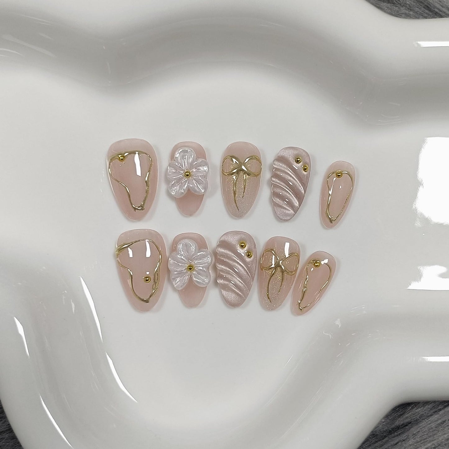 TENPAL 10Pcs Short Almond Oval Press On Nails With Tools,Nude Pink Fake Nails with 3D Flowers & Cat Eye Designs,Glitter Gold Edge Glue on Nails, Glossy Handmade Acrylic False Nails for Daily Party(XS)