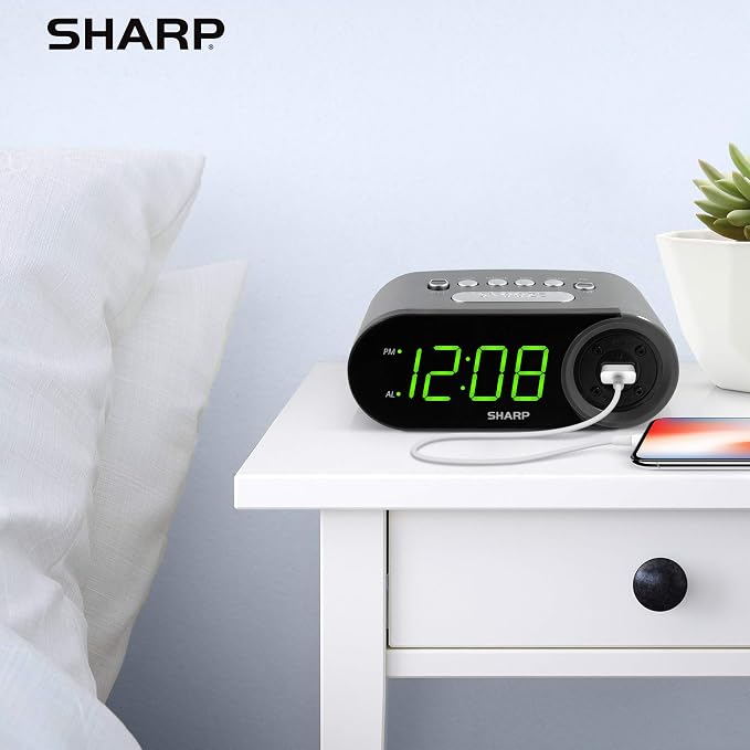 Sharp Digital Alarm Clock with 2A USB Charging and Green LED Display | 2A high-speed USB port; Easy-read green LEDs; Simple controls; Phone or tablet charging; Black
