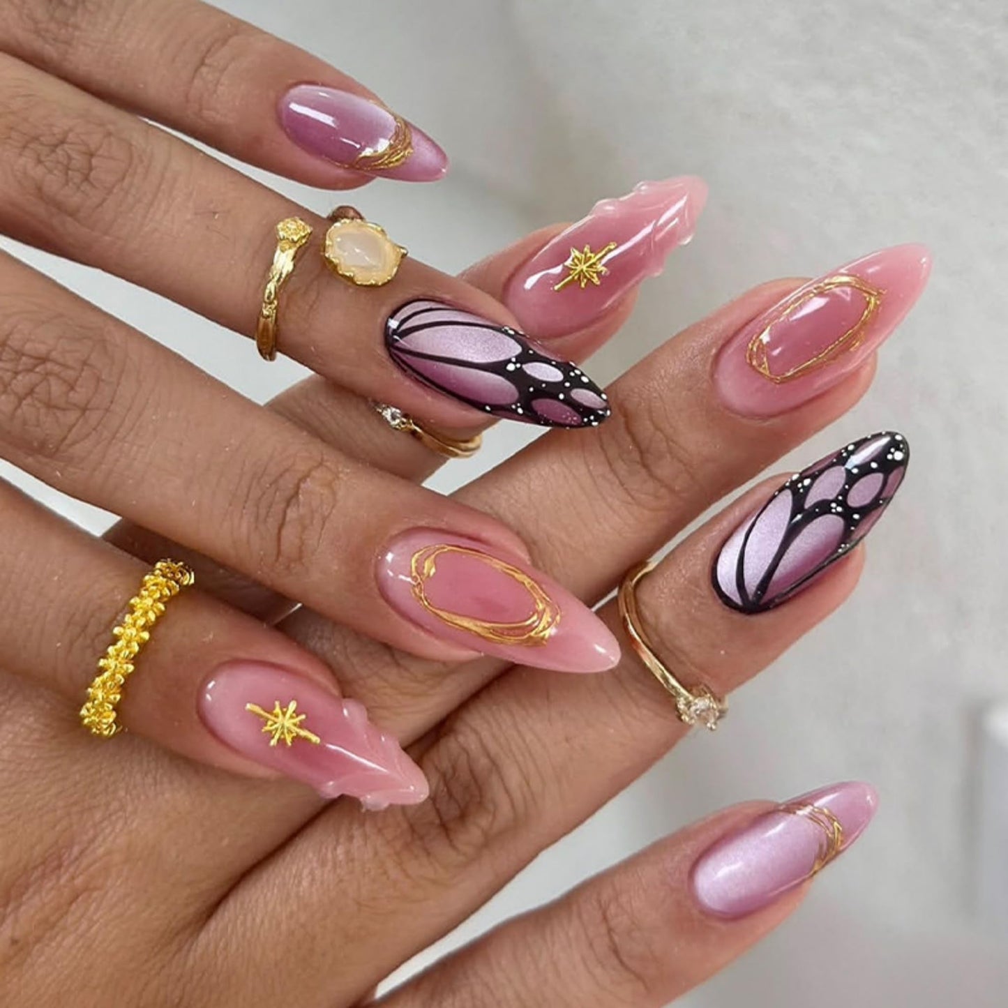 Almond Press on Nails Long Fake Nails Pink Acrylic Nail Press ons SEENEEY Gold Charm and Butterfly Designs Cute Stick on Nail for Women 24pcs