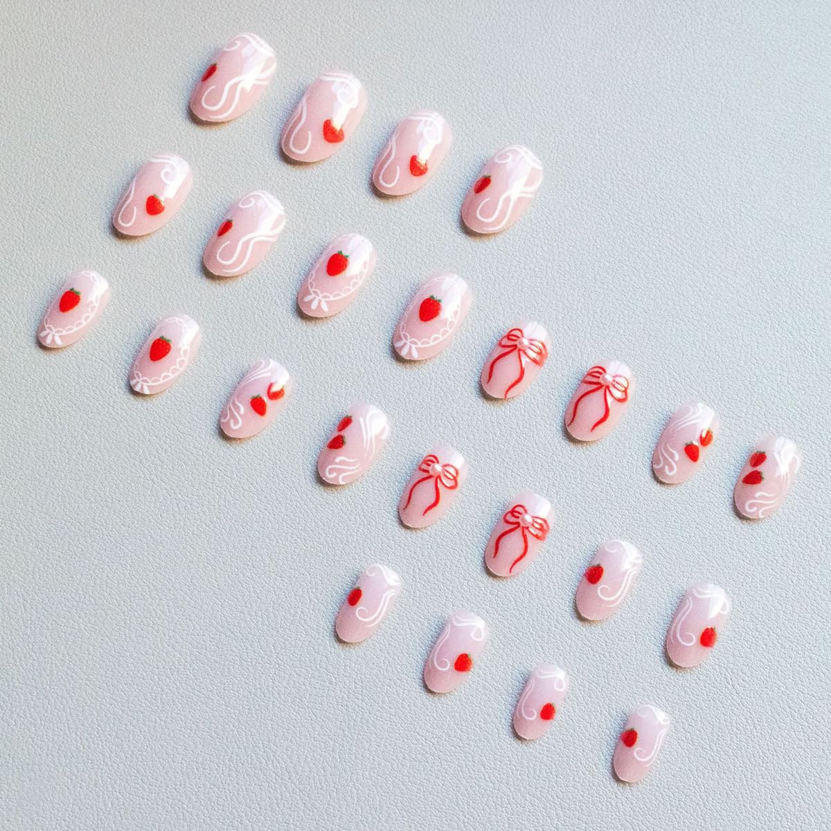 Medium Oval Press on Nails Nude Fake Nails Spring Nails Press ons with Cute Strawberry, Bow Design,Reusable Artificial Nail Full Cover Stick on Nails for Women Manicure 24Pcs