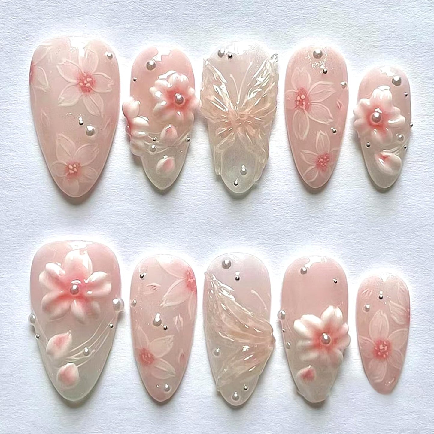 CJDLTS Pink Flower Press on Nails Medium Almond Shaped Artificial Acrylic Nails Gradient 3D Floral with Pearl Design Stick on Nails Full Cover Reusable Coffin Artificial Fingernails for Women Manicure