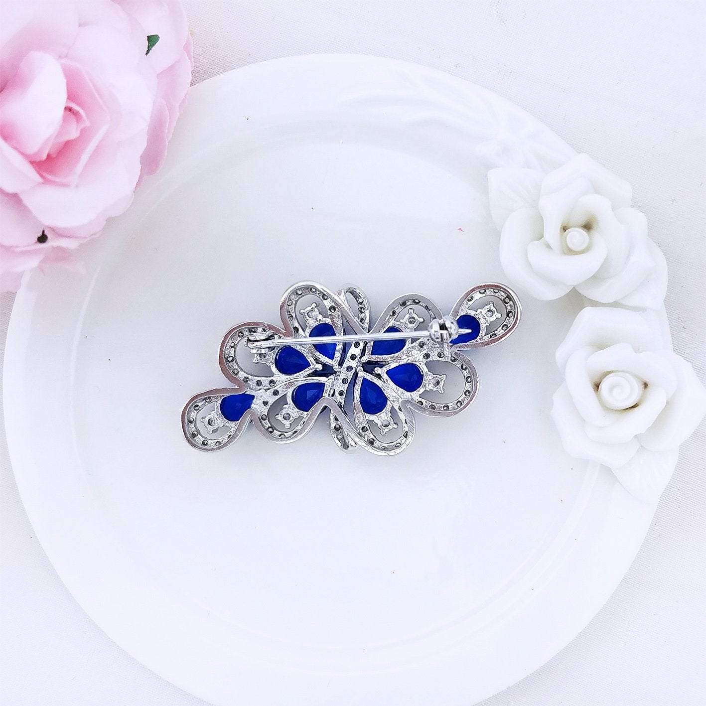YOQUCOL Luxury Cubic Zirconia Crystal Rhinestone Dark Blue Stone Ribbon Shape Silver Tone Brooch Pin for Women