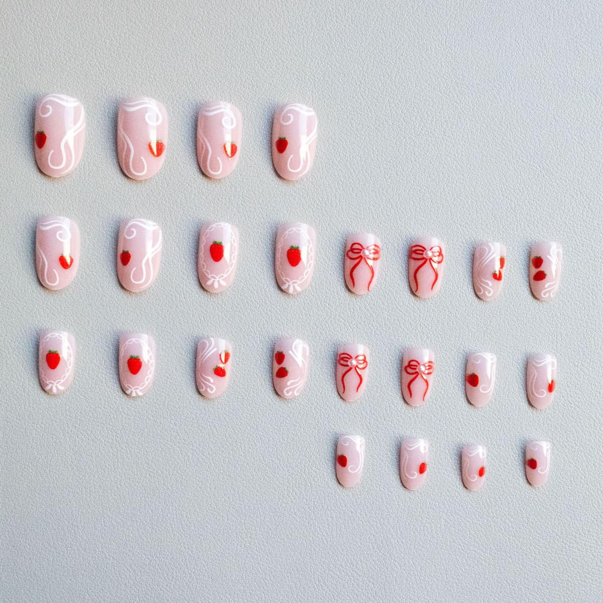 Medium Oval Press on Nails Nude Fake Nails Spring Nails Press ons with Cute Strawberry, Bow Design,Reusable Artificial Nail Full Cover Stick on Nails for Women Manicure 24Pcs