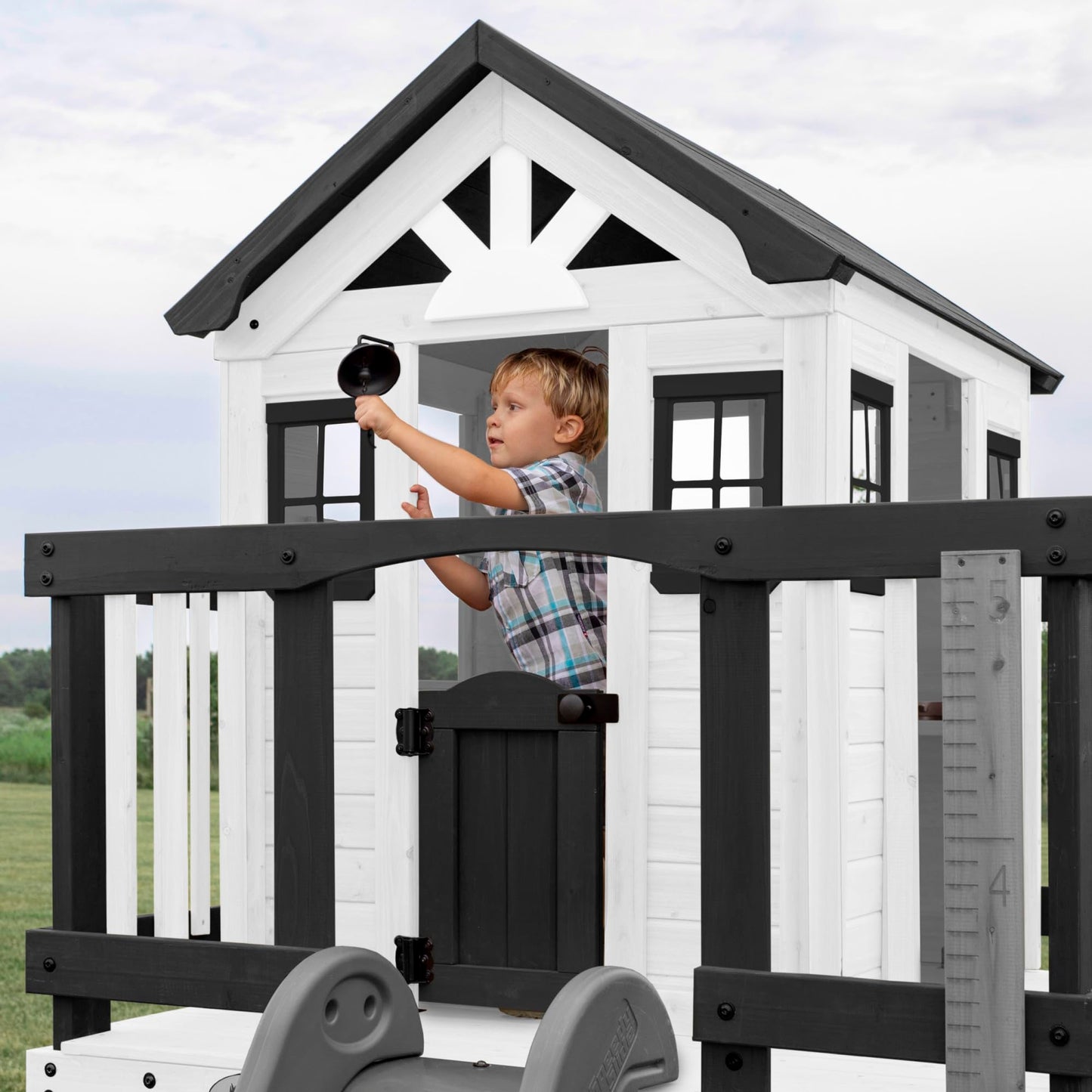 Backyard Discovery Sweetwater Heights White Elevated Cedar Wooden Kids Playhouse with Wave Slide, Play Kitchen, Step Ladder, Half Door, Wrap-Around Deck, Windows, Bell, Growth Chart for Outdoor Play