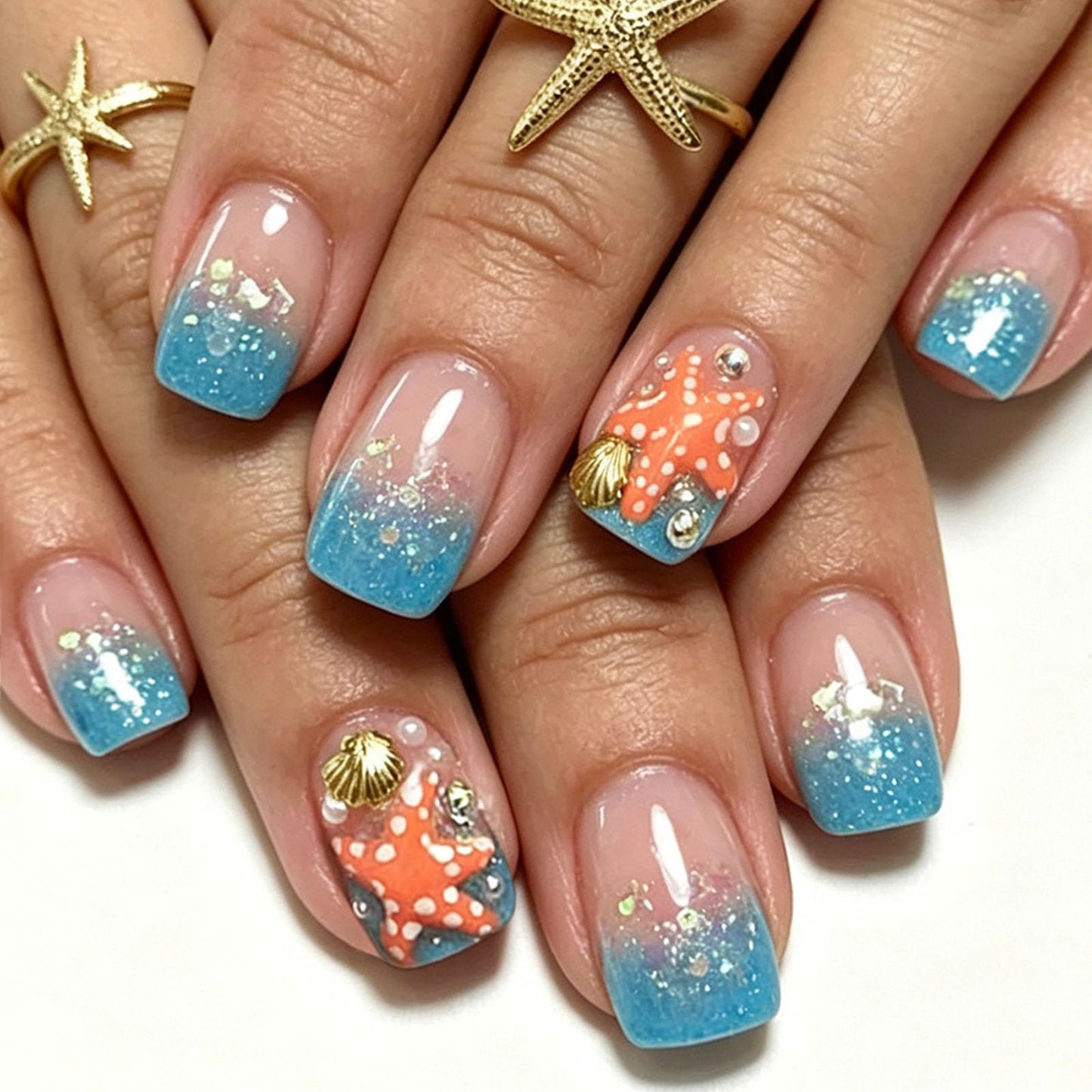 Glitter Press on Nails Short Square Fake Nails with Shell Starfish Pearl Rhinestones Designs Nails Press ons Blue Nude Ombre Glue on Nails Cute Artificial Nails Summer Stick on Nails for Women 24Pcs