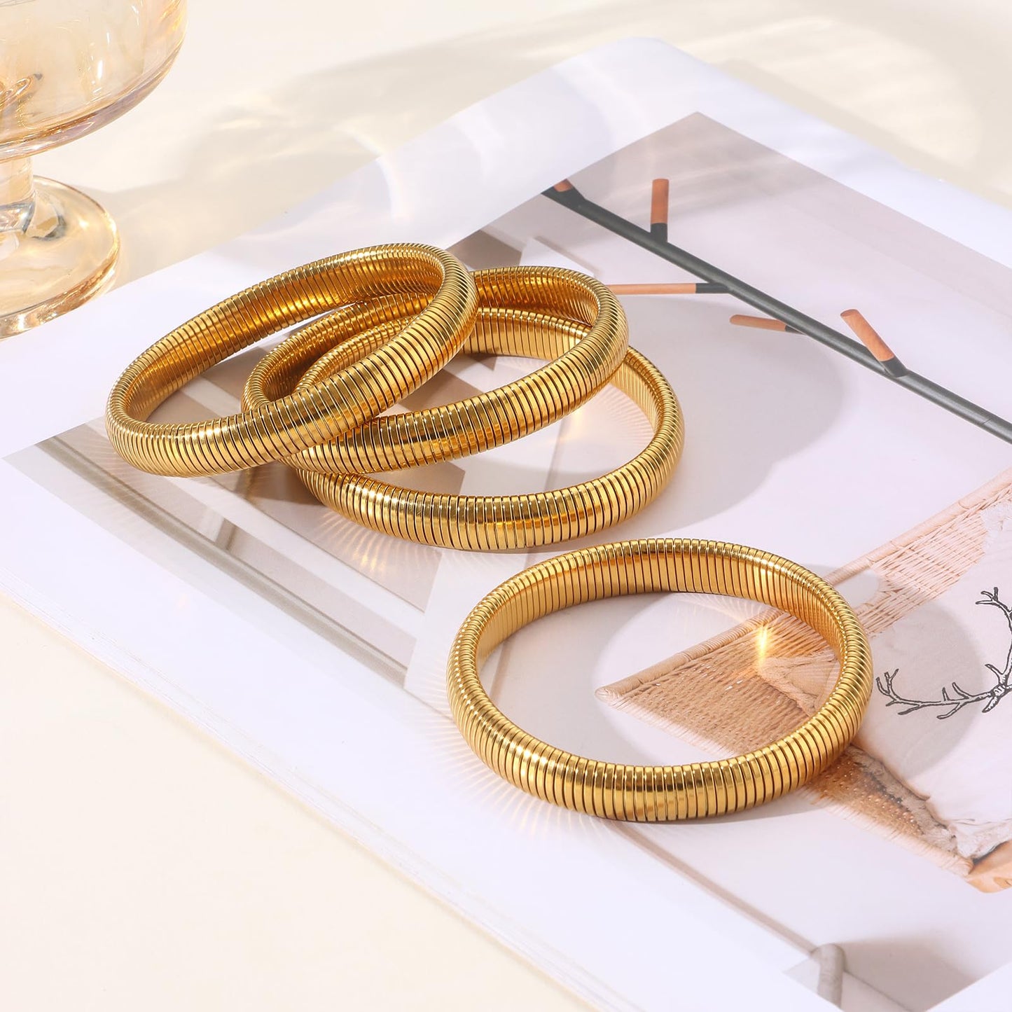 Giovanchi 18K Gold Plated Bangles for Women Set of 4 Chunky Stretch Bangles Bracelets Stainless Steel Bracelets Flexible Wide Stack Bracelets for Women