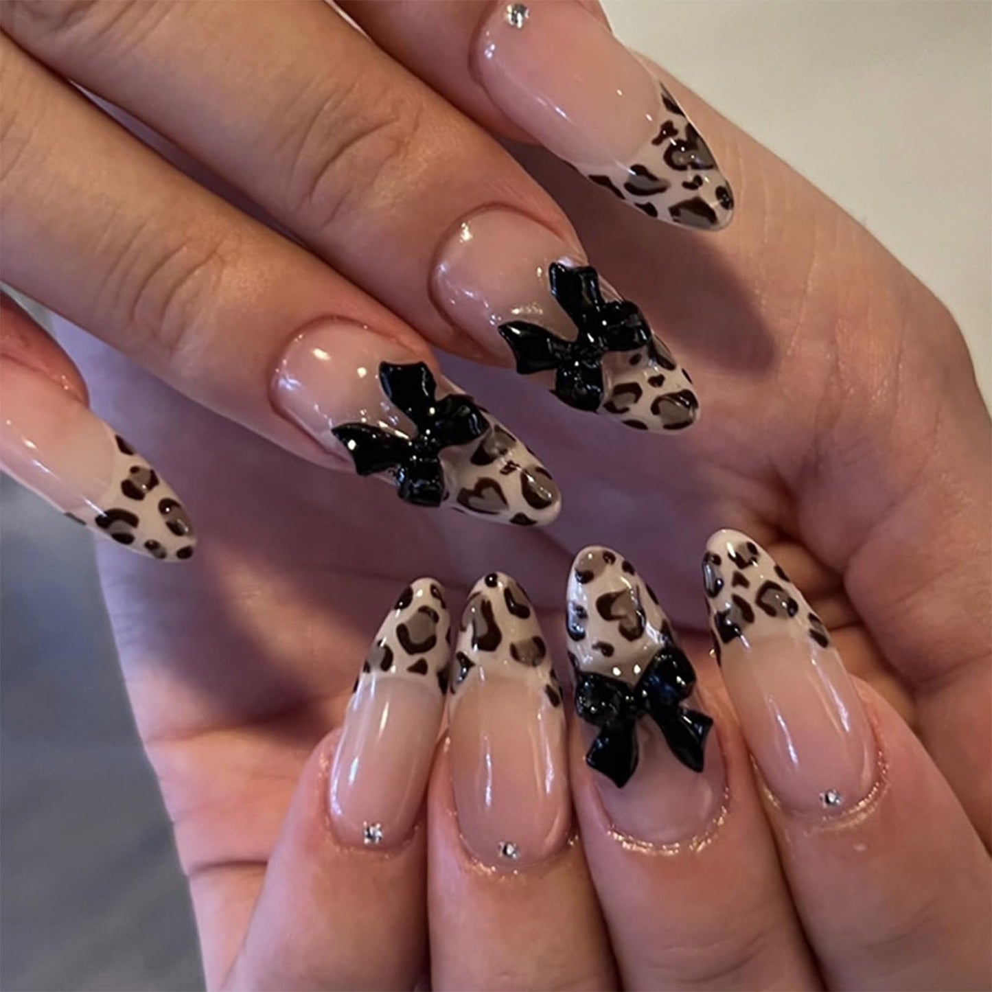IMRAIN Medium Almond Press on Nails Leopard Print French Tips Fake Nails with 3D Black Bow Charm Design Brown Glossy Glue on False Nails Full Cover Stick on Nails 24Pcs