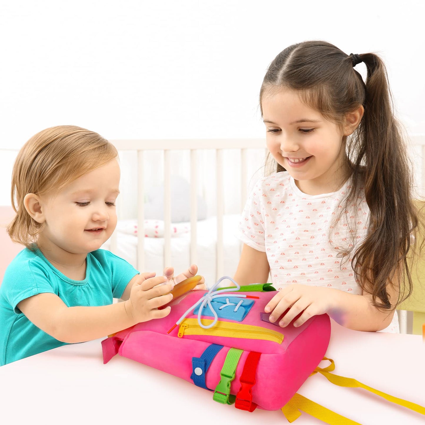 Busy Board - Toddler Backpack with Buckles and Learning Activity Toys - Develop Fine Motor Skills and Basic Life Skills - Learn to Tie Shoes - Children's Travel Toy (Pink)