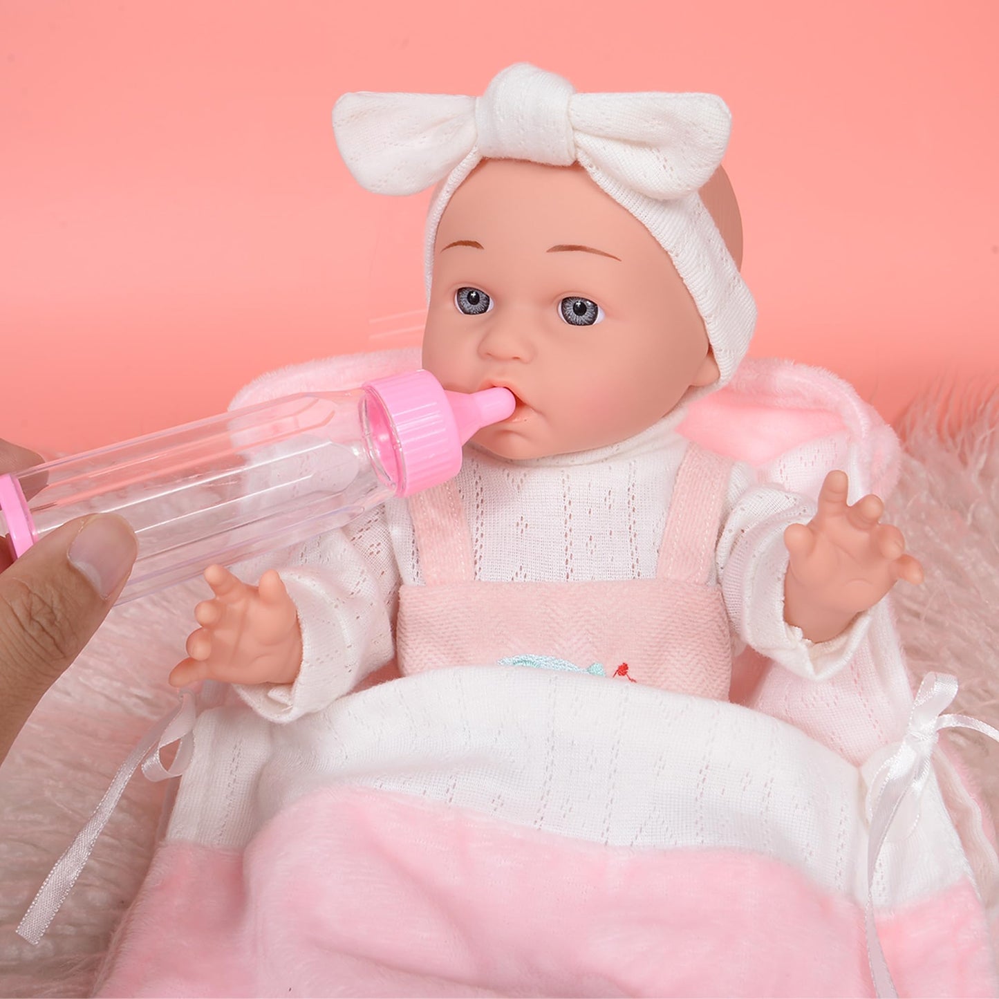 dollbie 12 inch Baby Doll - Adorable Doll and Accessories Including Romper, Sleeping Bag, Feeding Accessories, Rabbit Plush Toy