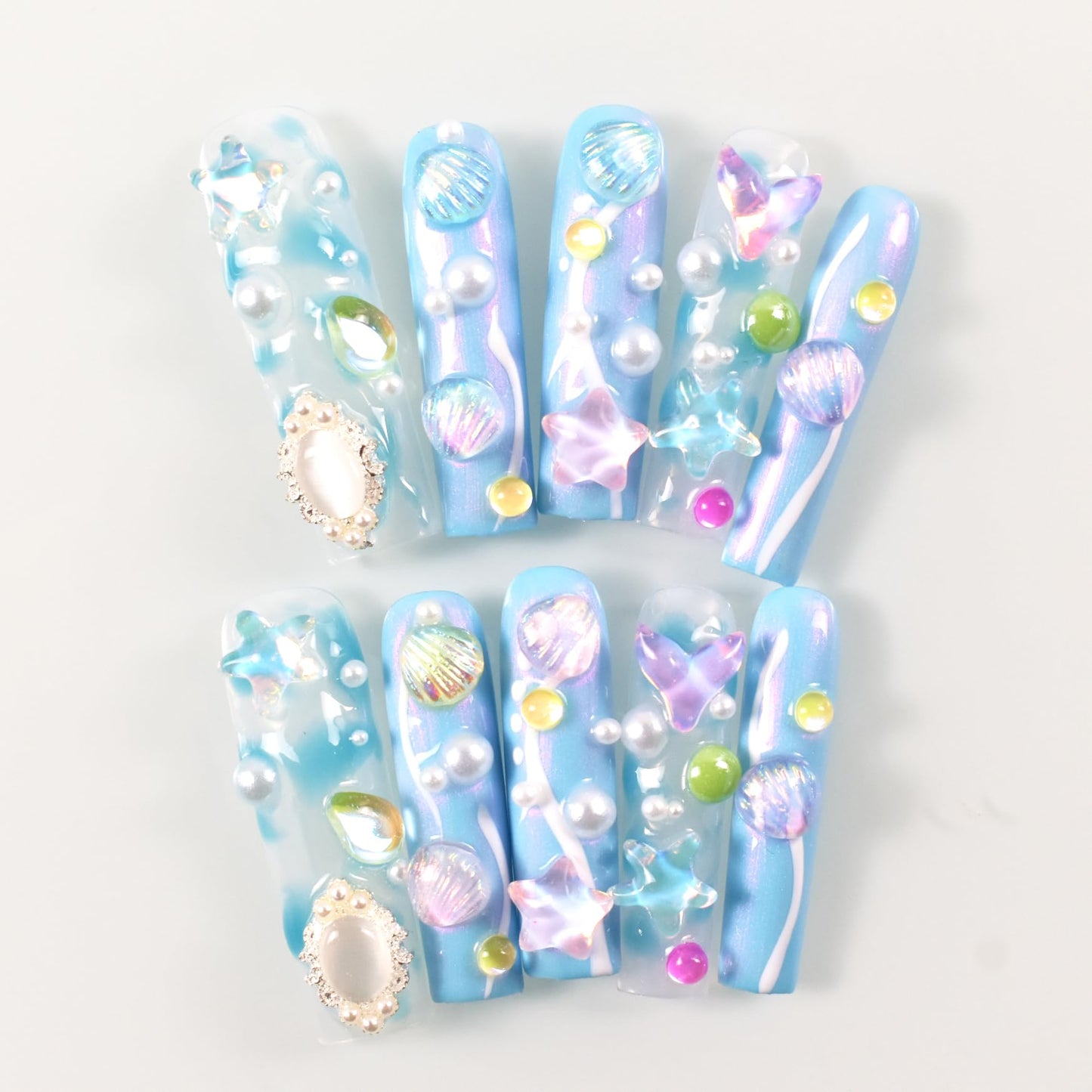 LIFOOST Aurora Blue Handmade Press on Nails Dreamy Ocean Ice Transparent 3D Shell Star Pearls Charms Fake Nails Mermaid False Nails Extra Long Coffin Press ons for Summer, Size M