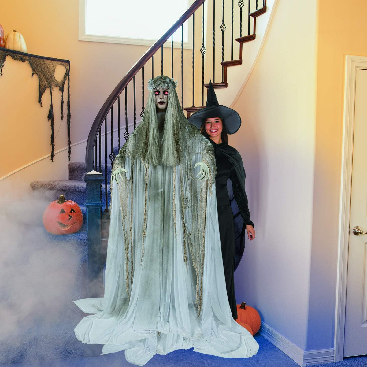Fun Express Standing Ghost Girl Halloween Decoration, 5 feet 7 inch, Plastic and Metal, Flashing Red Eyes with Tatterered Gown, Great for Indoor, Outdoor and Porch Halloween Spooky Decor - White