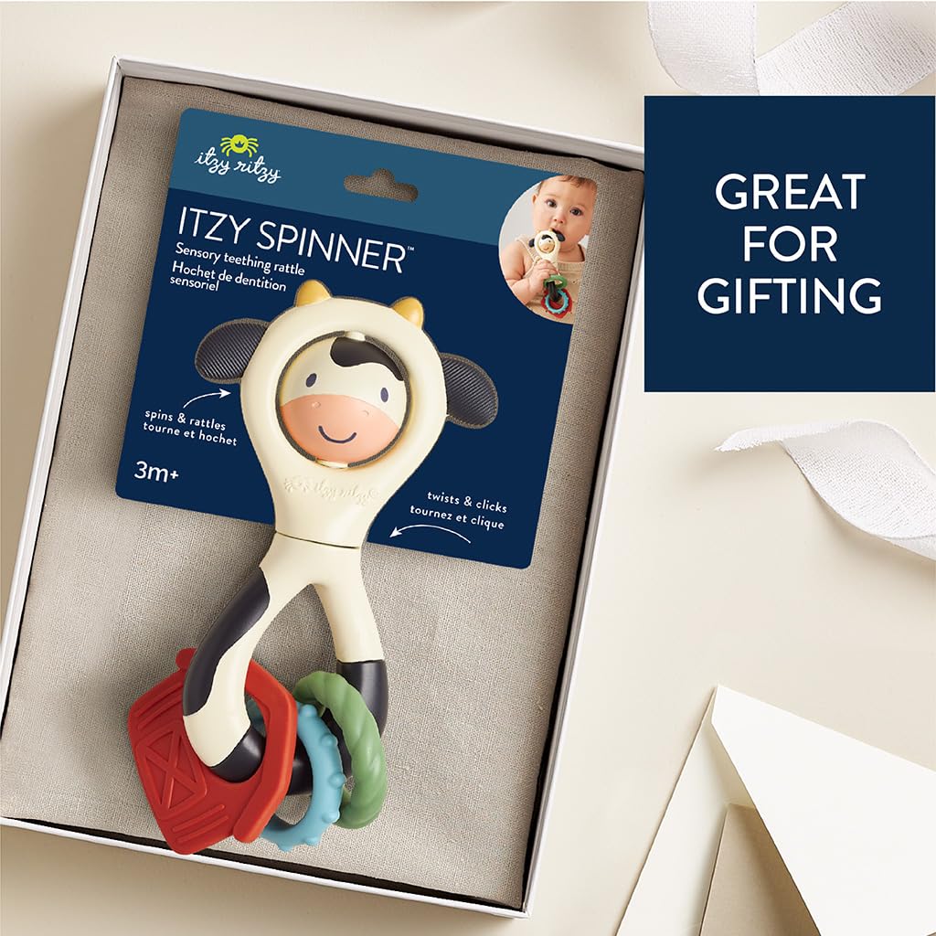 Itzy Ritzy Spinner Rattle Toy – Cow Design Sensory Teething Rattle Includes Spinning Face, Clicks, Rattles & Textured Teethers – Designed for Ages 3 Months and Up (Cow)