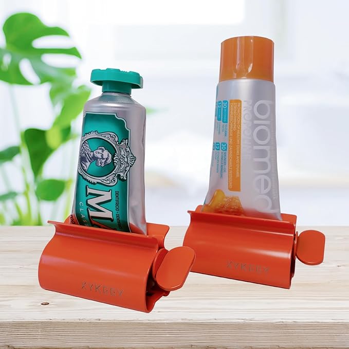 XYKEEY Set of 2 Toothpaste Squeezer Rollers, Metal Toothpaste Tube Wringer Seat Holder Stand (Orange)