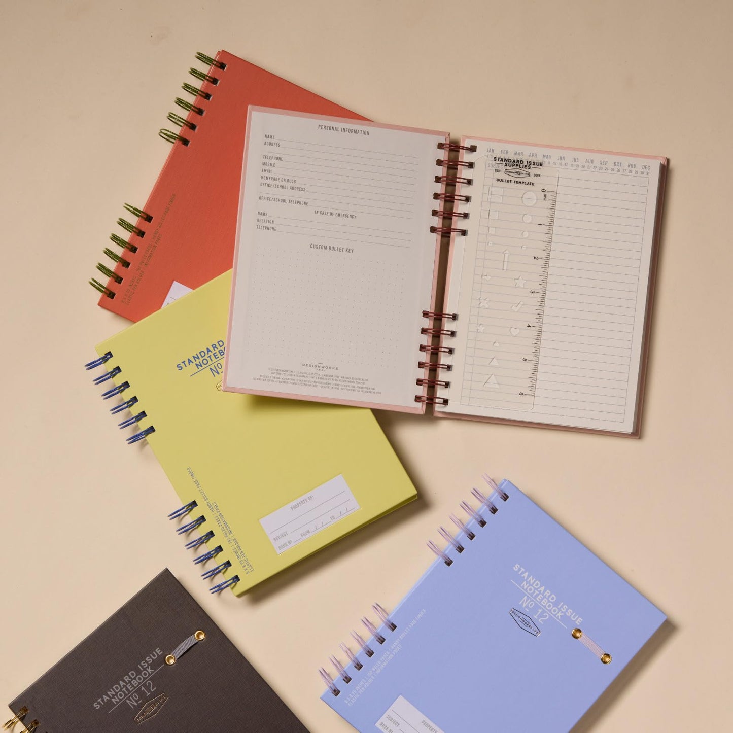 DesignWorks Ink Standard Issue Notebook No. 12, Undated Daily Planner & Writing Journal, 192 Lined Pages, Elastic Pen Holder, Small Spiral Notebook for Work & Journaling, 6 x 8.25 in, Army Green + Chili