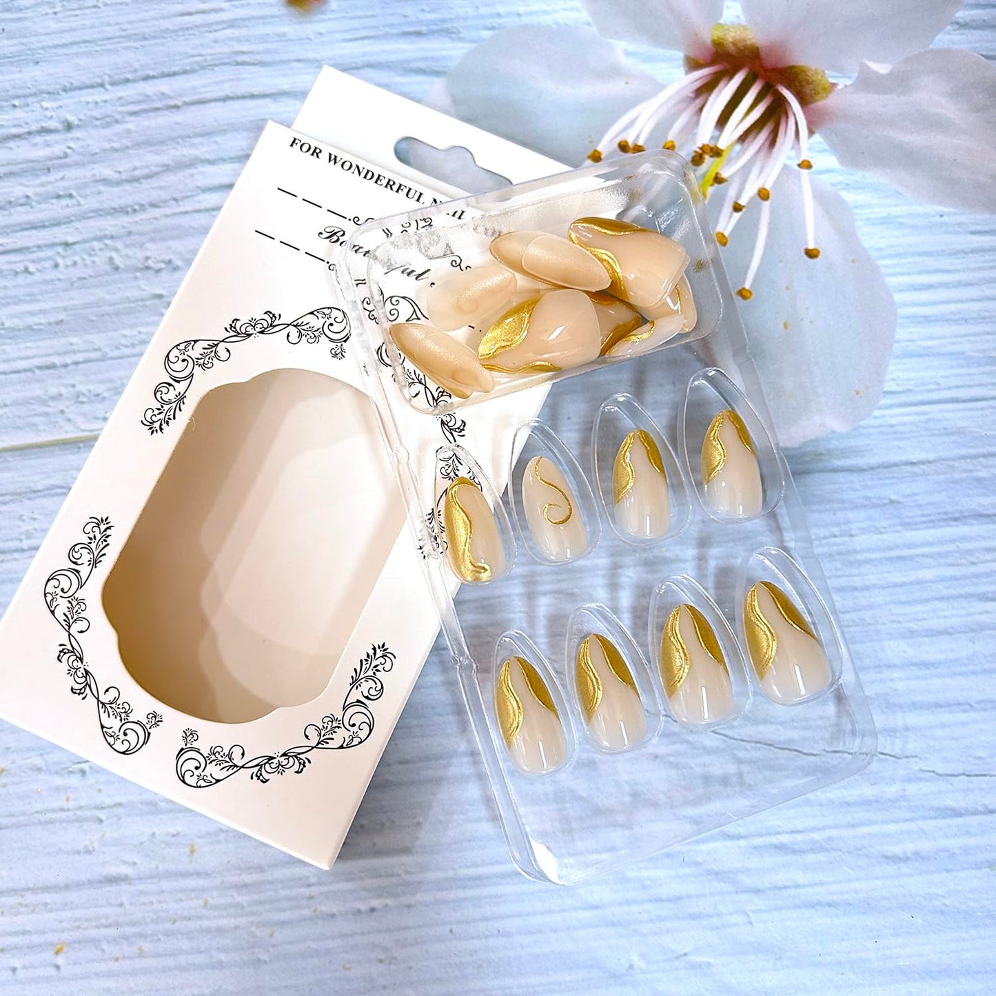 CJDLTS Gold Press on Nails Medium Length Golden 3D Irregular Lines Design False Nail Nude Artificial Stick on Nails Acrylic Press Ons Reusable Glue on Nail for Women 24Pcs