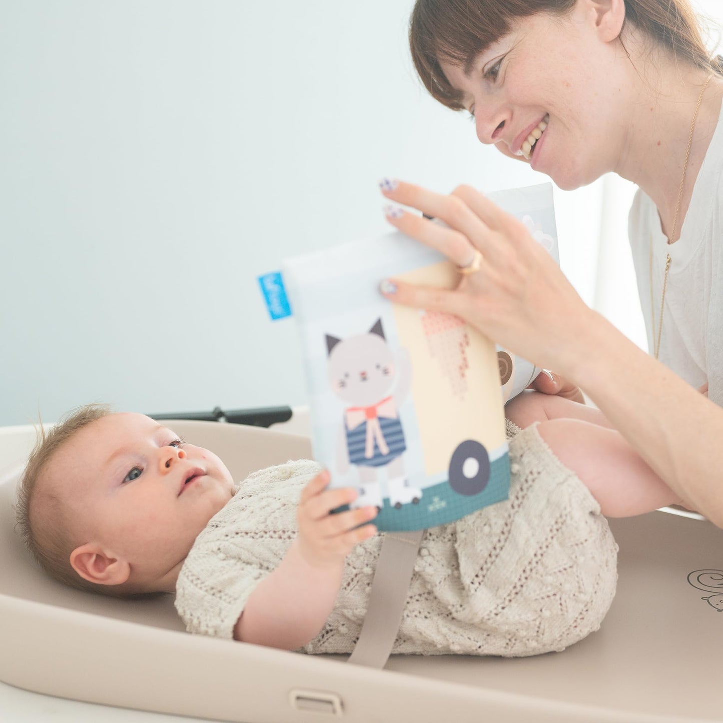 Taf Toys Baby Changing Pad & Crinkle Book - Interactive, Waterproof, Wipeable Changing Table Pad - Diaper Changing Pad for Dresser with Removable Safety Strap, Easy to Clean & Non-Slip Waterproof