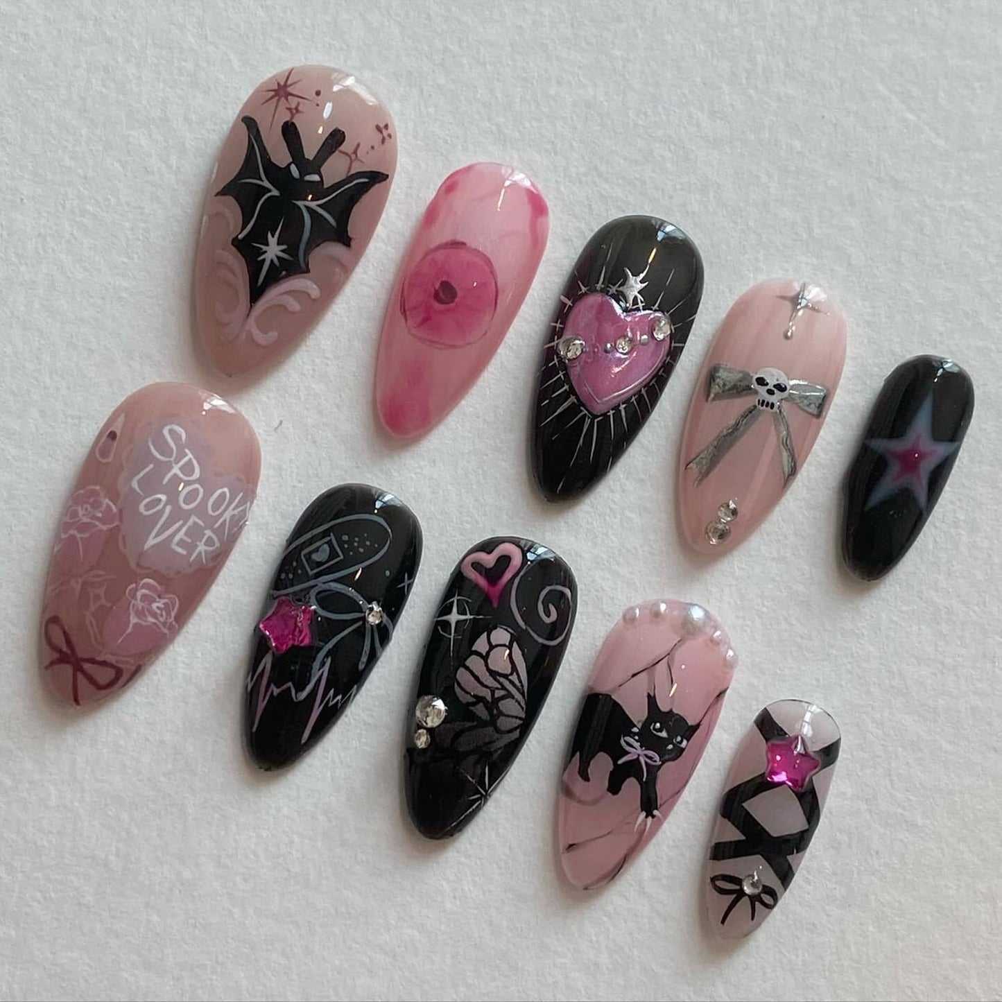 24Pcs Gothic Press on Nails Medium Almond Fake Nails Cat Bow Heart with Rhinestones Gems Charms Glitter Design Full Cover Y2k Glue on Nails Black Pink False Nails for Women Artificial Acrylic Nails