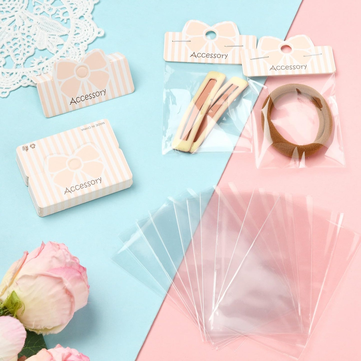 Gelirda 50 Sets Packaging Pouch with Foldable Header Cards Bowknot Printed Paper Cards & Rectangle Cellophane Bags for Jewelry Display