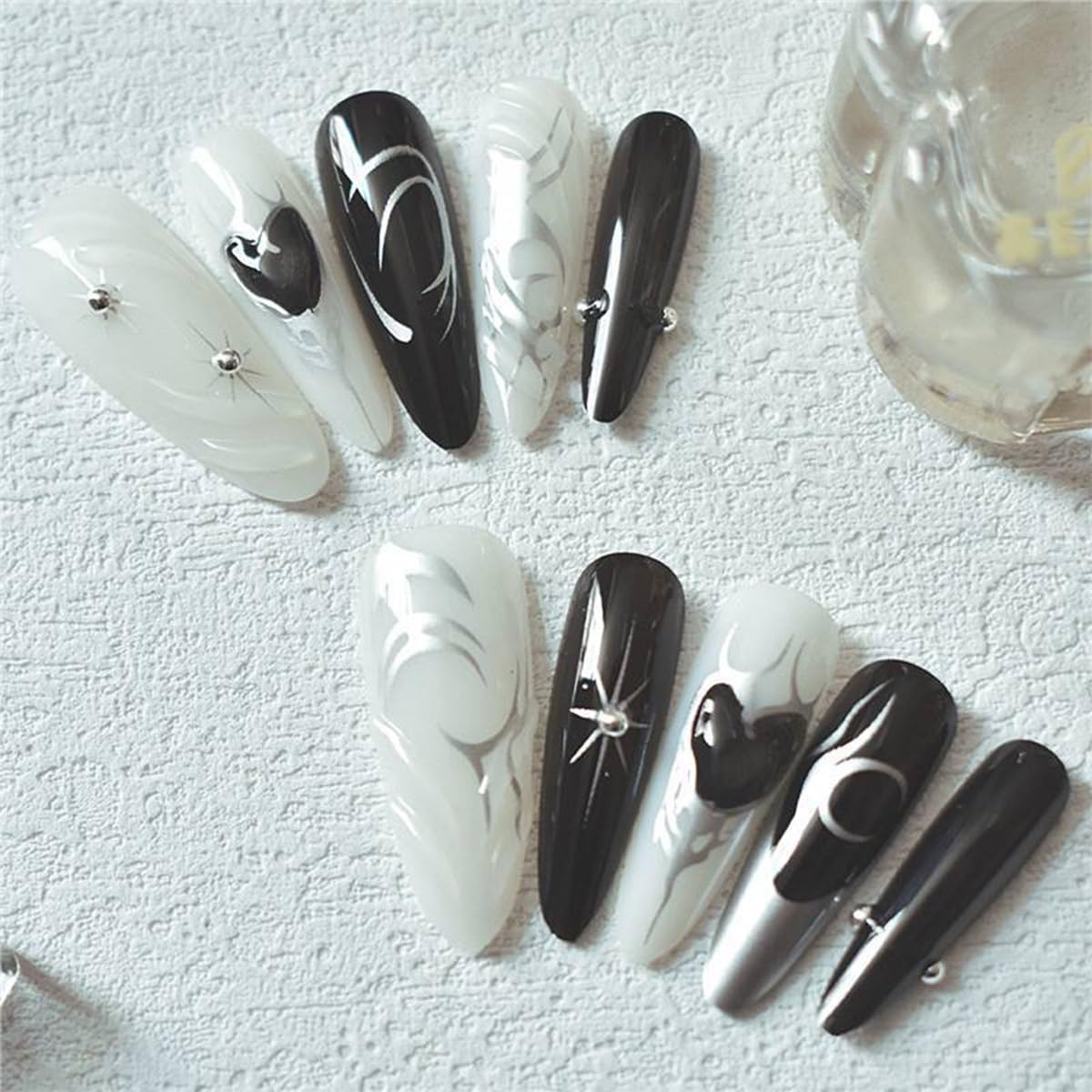24Pcs Black Press on Nails Medium Almond Fake Nails with Silver Star Heart Rhinestones Designs Glossy Acrylic Full Cover Stick on Nail Gothic Dark Black Style False Nails for Women DIY Nails Salon