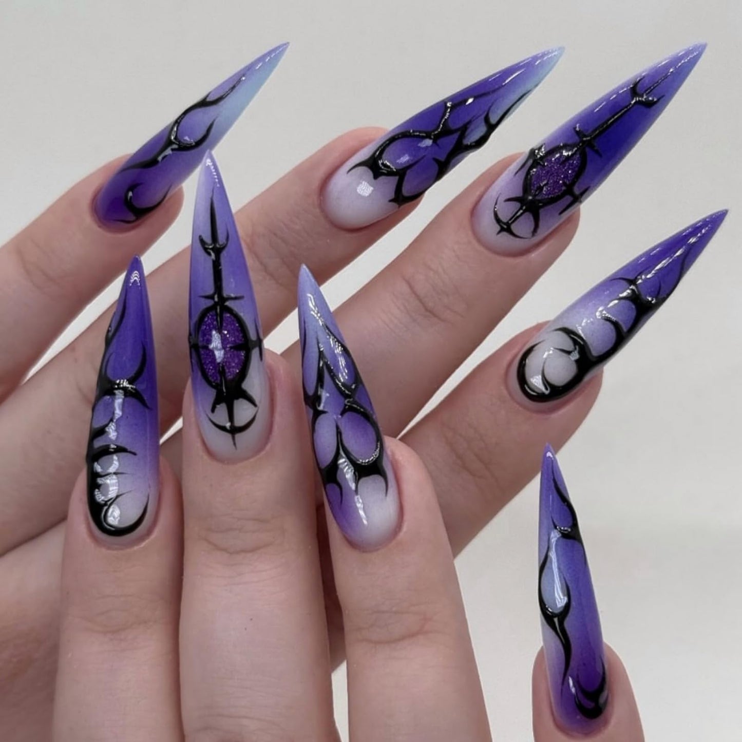 SEENEEY Halloween Press on Nails Long Stiletto Fake Nails Purple Artificial Nail Press ons with Black Charm Designs Designs Stick on Nail for Women 24pcs