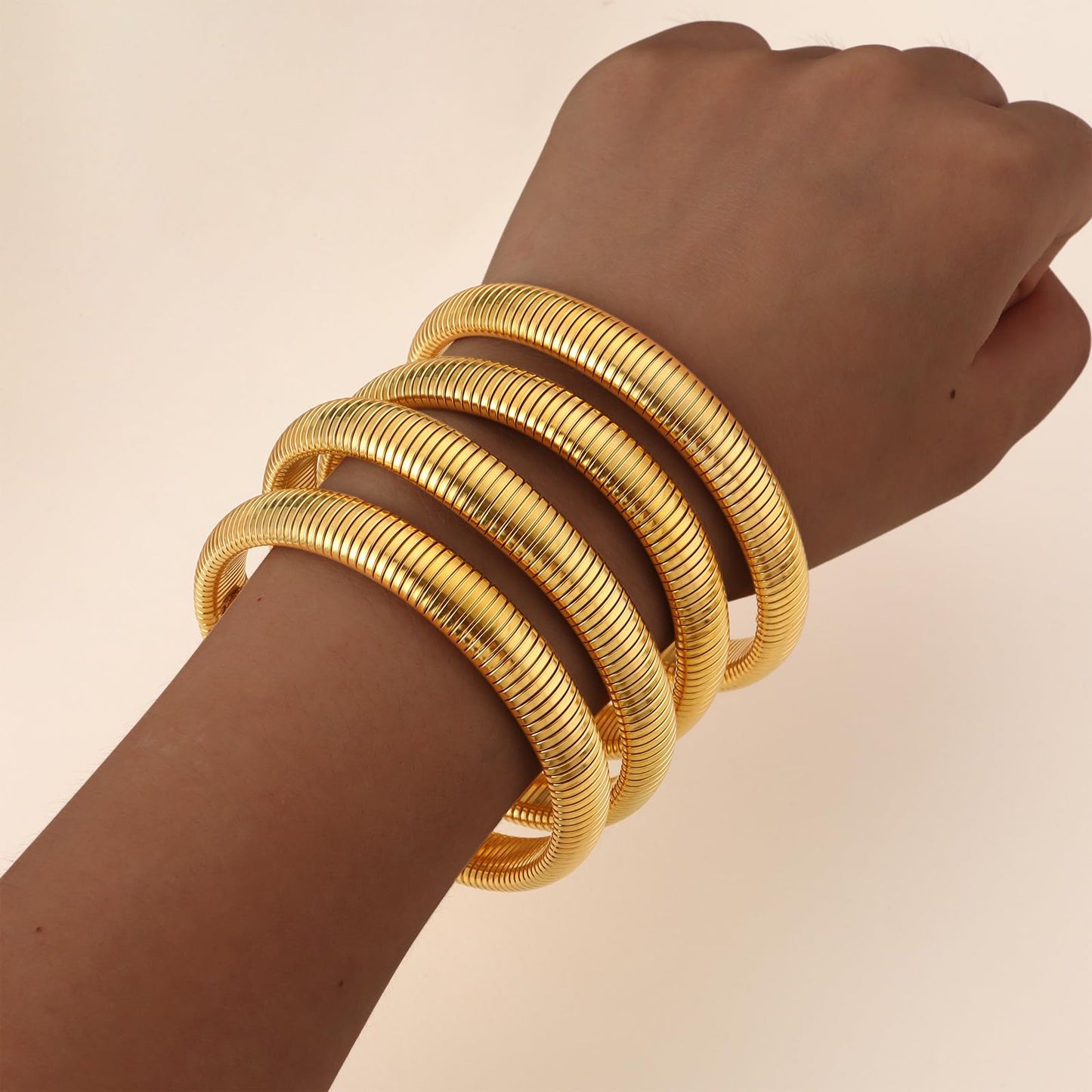 Giovanchi 18K Gold Plated Bangles for Women Set of 4 Chunky Stretch Bangles Bracelets Stainless Steel Bracelets Flexible Wide Stack Bracelets for Women