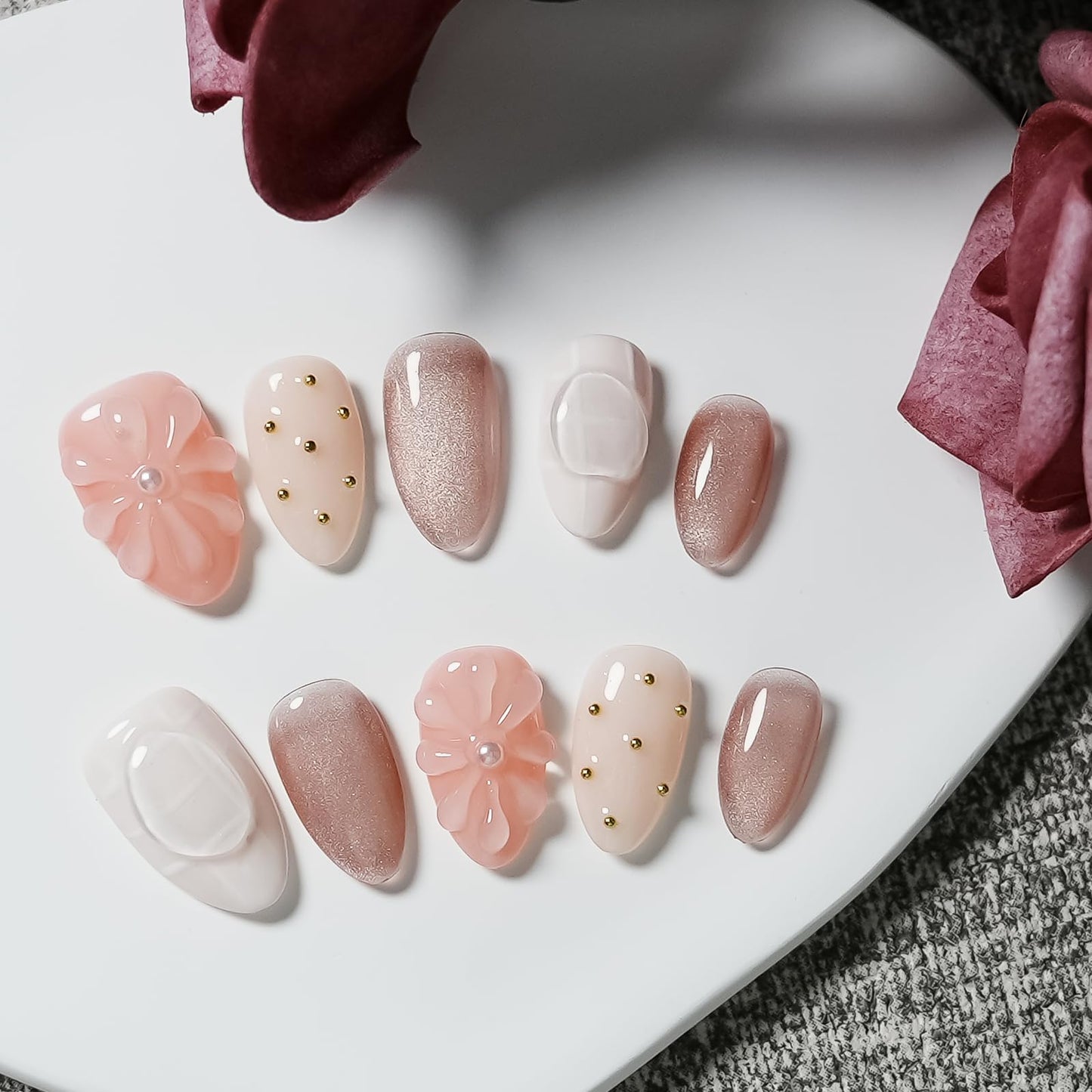 Tesytto Nude Pink Press on Nails Short Almond Cat Eye Fake Nails with 3D Sleek Water Drop Design Glossy Finish Glitter Full Cover Acrylic Nails (Ice Flowers,S)