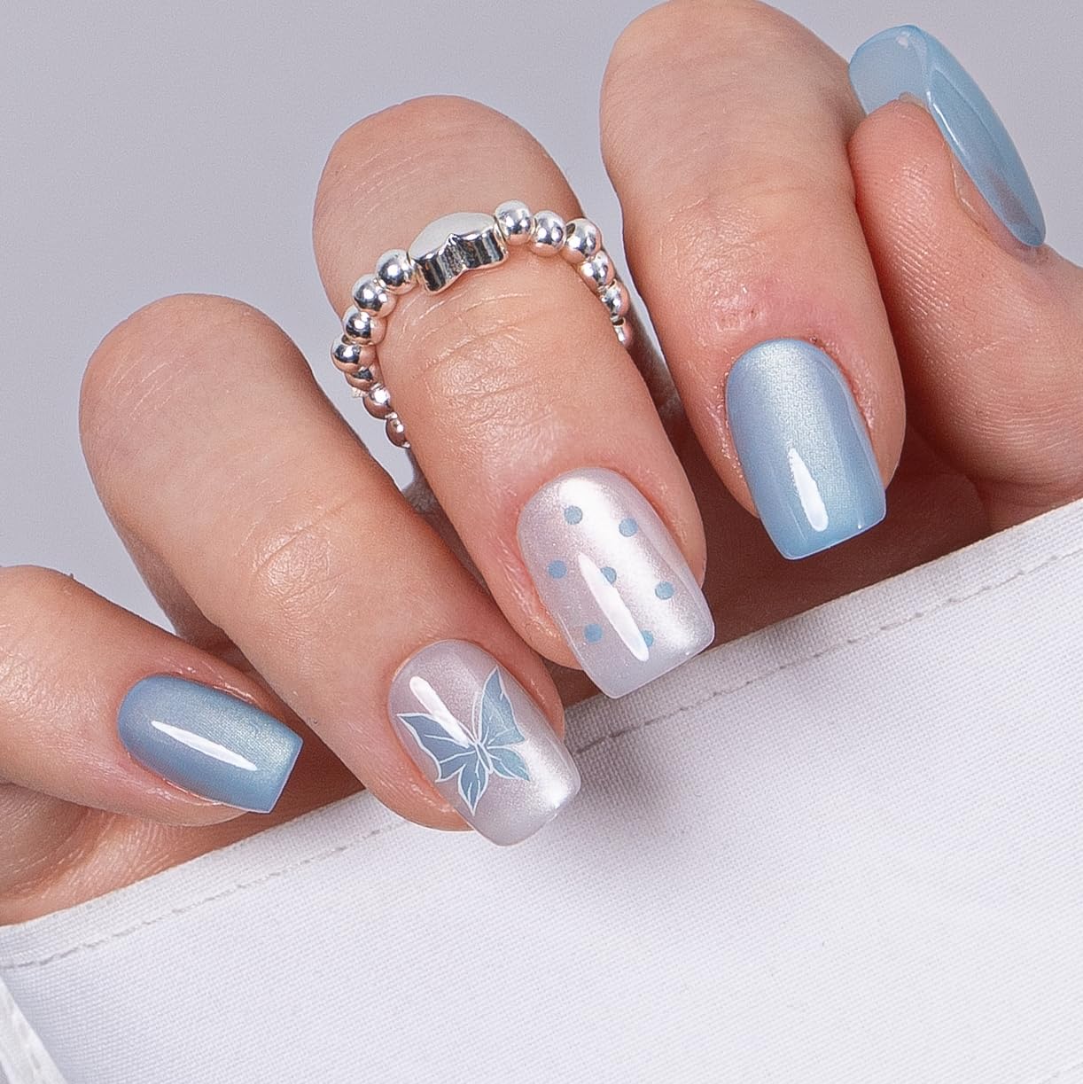CurvLife Press on Nails Short Square Acrylic Fake Nails with Apricot Design Full Cover False Nails Glossy Nude Glue on Nails Artificial Stick on Nails for Women (Blue Flutter)