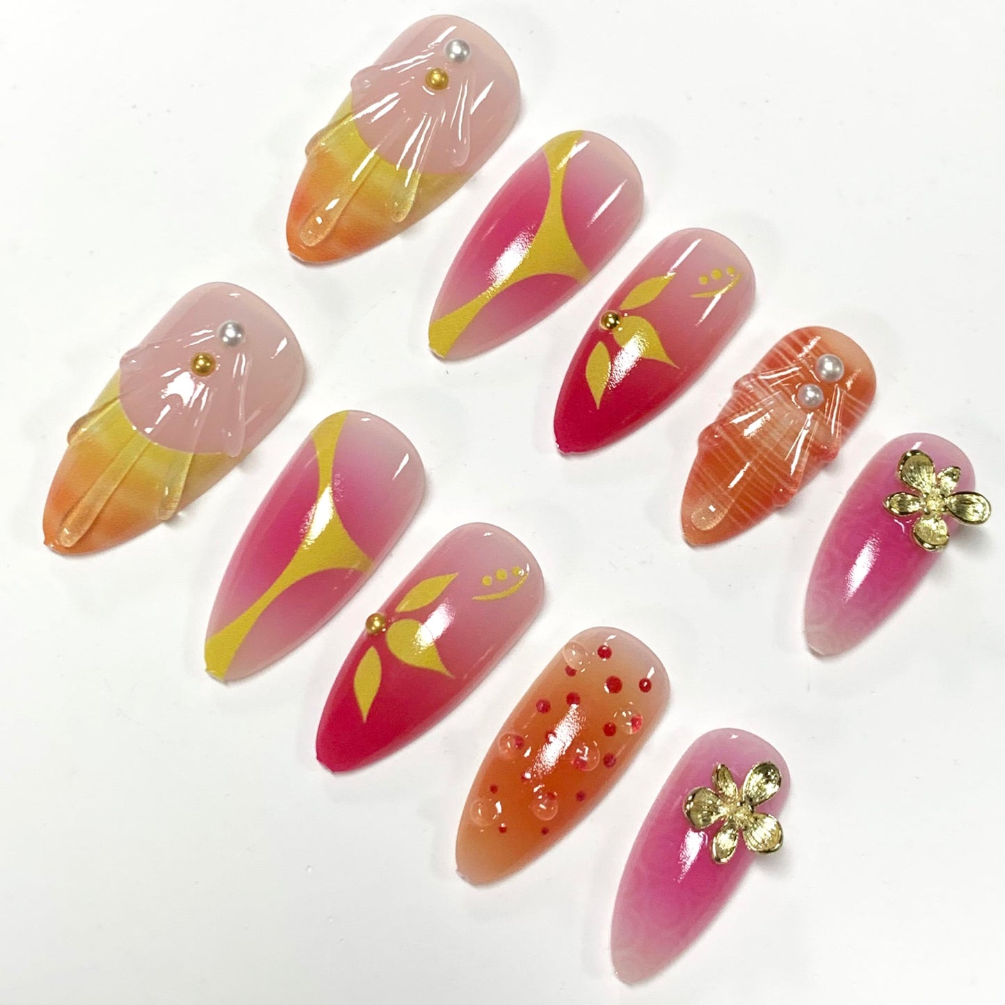 BABALAL Press On Nails, Medium Almond Fake Nails, Sunset Orange Pink Marble with Gold Flower Charm, Glossy Summer Tropical Glue On Nails for Women and Girls 24Pcs Reusable