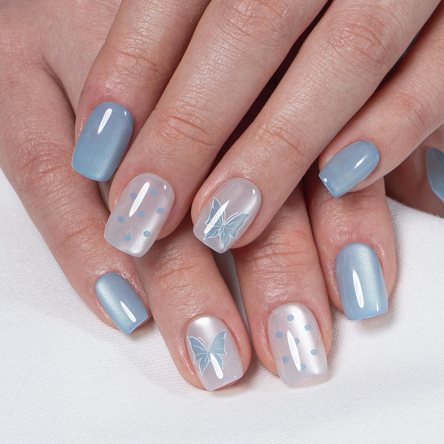 CurvLife Press on Nails Short Square Acrylic Fake Nails with Apricot Design Full Cover False Nails Glossy Nude Glue on Nails Artificial Stick on Nails for Women (Blue Flutter)
