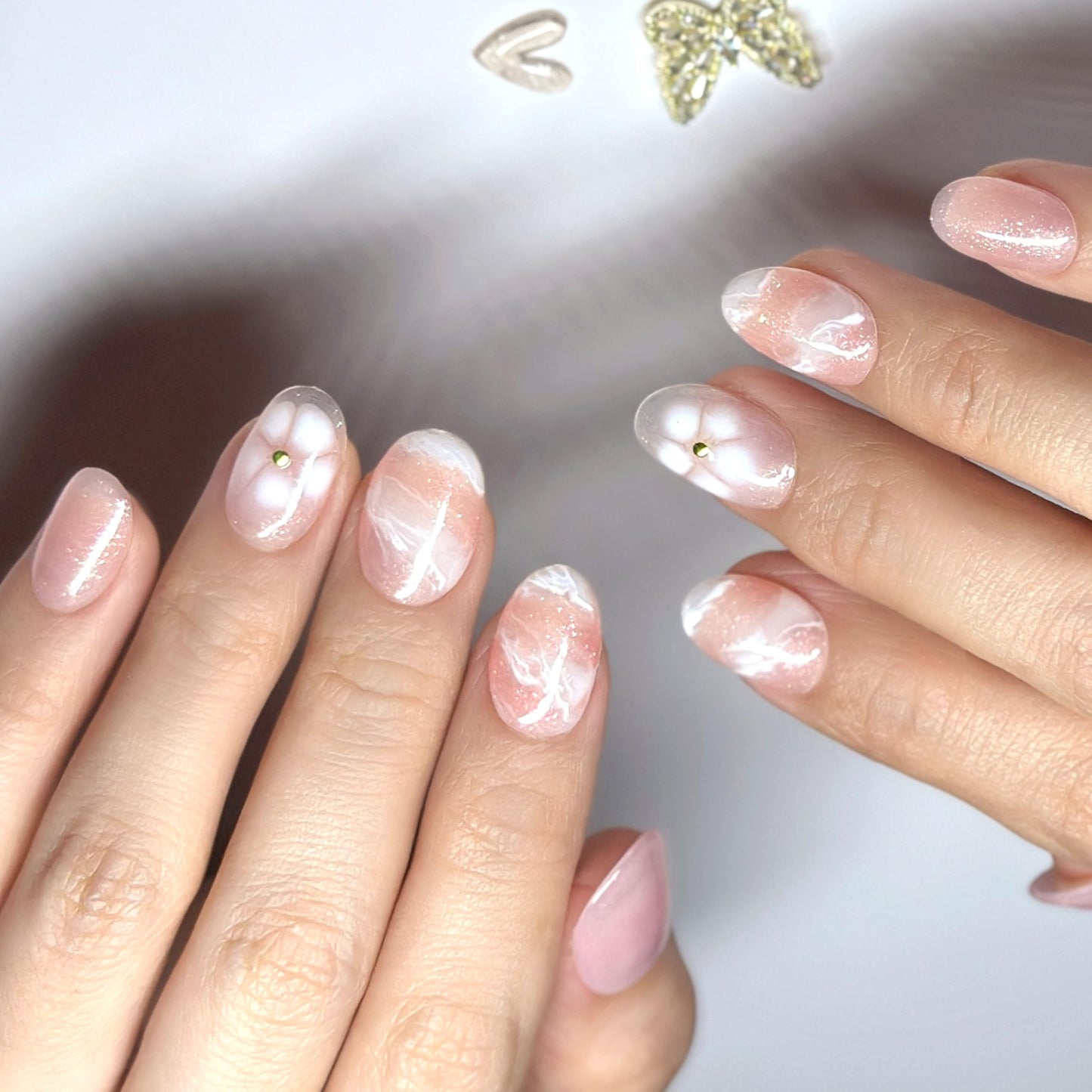Sunruby Hand-Painted Press-On Nails – Short Oval in Rosé Pink with White Floral Accents. Reusable Soft Gel Set (15 Sizes, 30 Nails + Glue) | Designed in Los Angeles | Rosé Luminesse