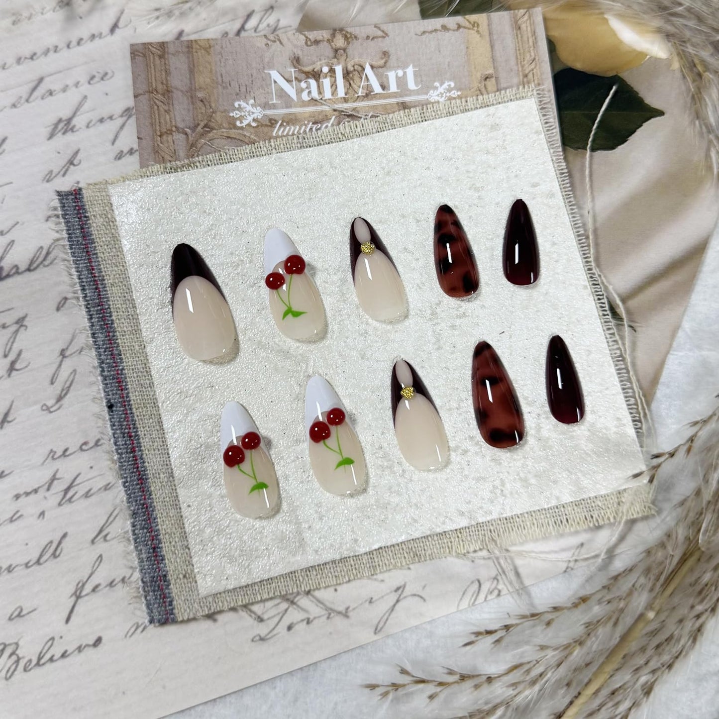 IMSOHOT Cherry Press on Nails Medium Almond Fake Nails Burgundy French Nail Tips Full Cover Glossy Glue on Nails Acrylic Artificial Cute False Nails for Women 24Pcs