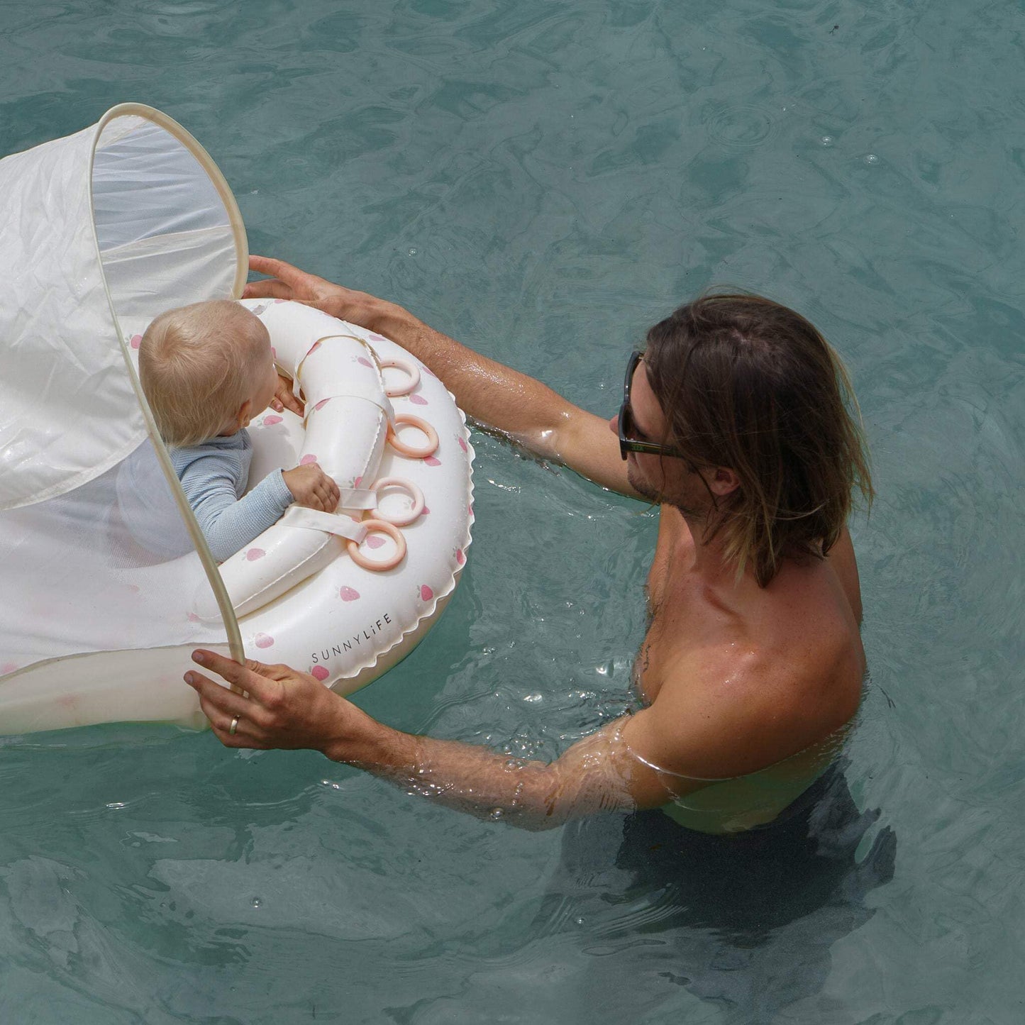 SUNNYLiFE Baby Float with Canopy — UPF40 Infant Pool Float, Adjustable Fabric Seat, 4 Silicone Play Rings | 6-12 Months - Strawberry Sunshine Pink