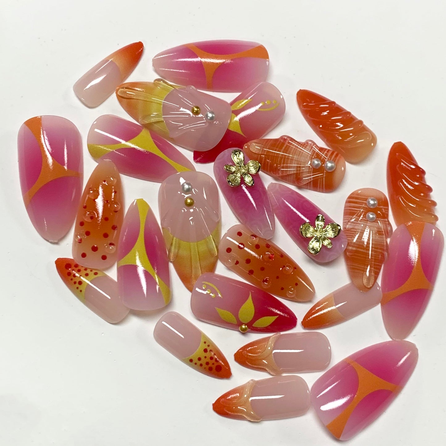 BABALAL Press On Nails, Medium Almond Fake Nails, Sunset Orange Pink Marble with Gold Flower Charm, Glossy Summer Tropical Glue On Nails for Women and Girls 24Pcs Reusable