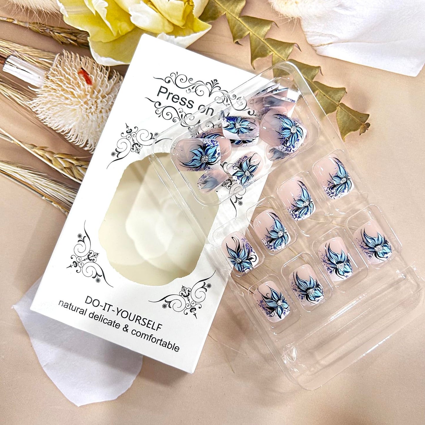 TBRZTR Blue Flower Press on Nails Short Square Artificial Coffin Nails Press Nails with Charm Acrylic Nails Nude False Nails Full Cover Glue on Nails Reusable Stick on Nails for Women 24Pcs