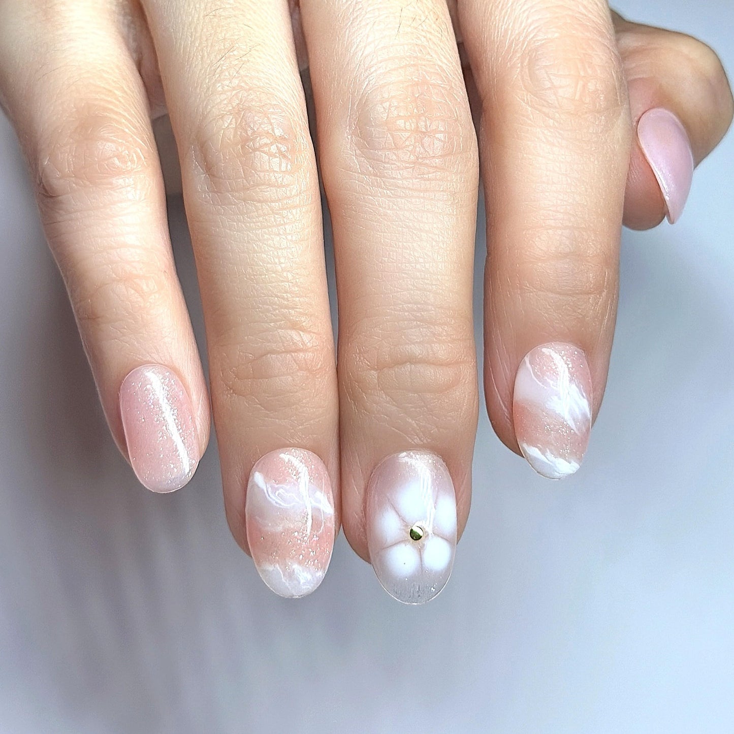 Sunruby Hand-Painted Press-On Nails – Short Oval in Rosé Pink with White Floral Accents. Reusable Soft Gel Set (15 Sizes, 30 Nails + Glue) | Designed in Los Angeles | Rosé Luminesse